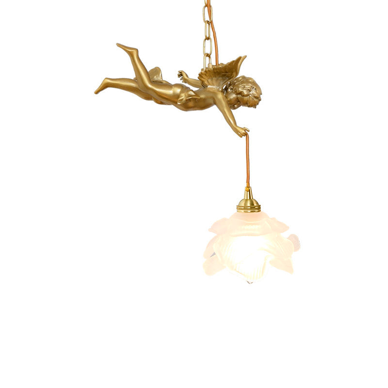 Detail of the polished brass finish on the lamp body.