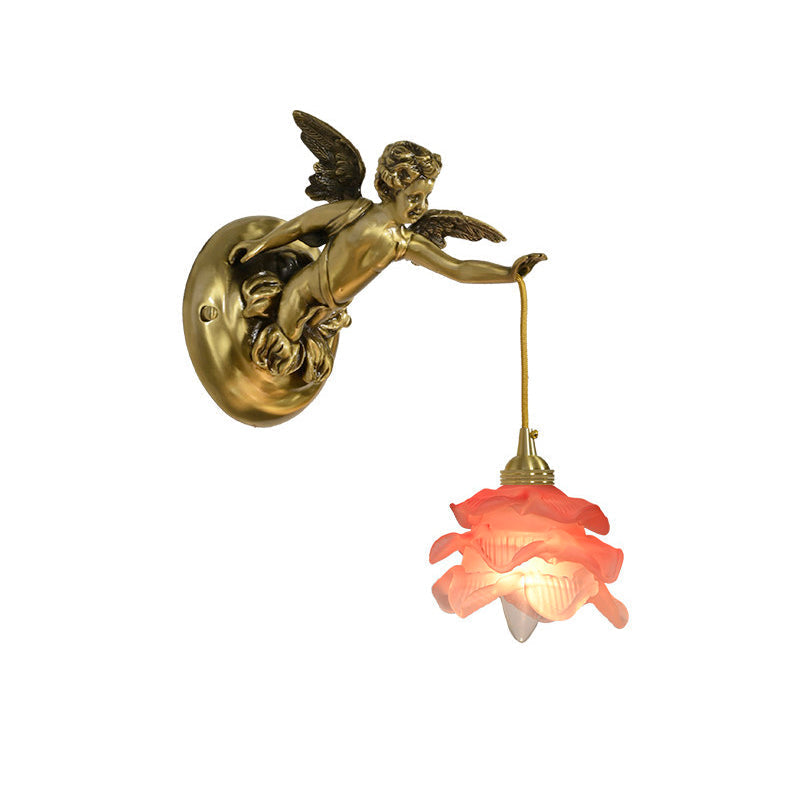 Detail shot of the intricate wings of the golden cherub.