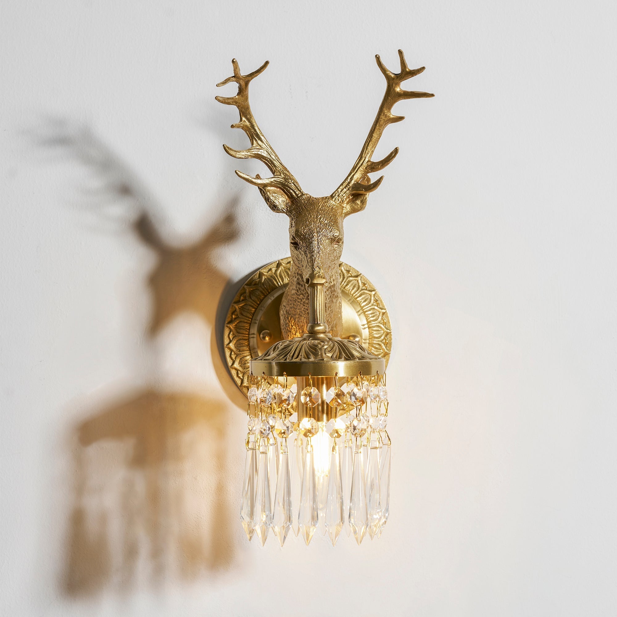 The sconce providing accent lighting in a living room.