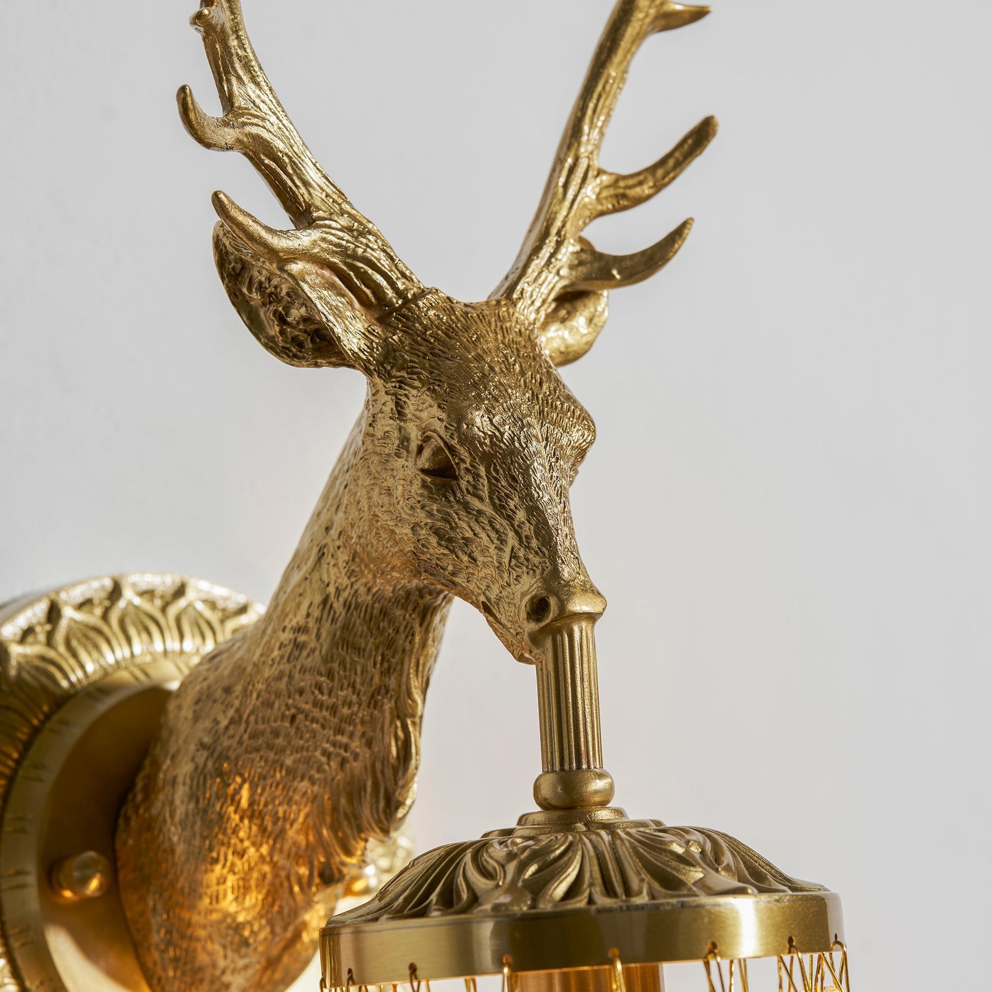 The sconce shown in a hunting-lodge themed decor.