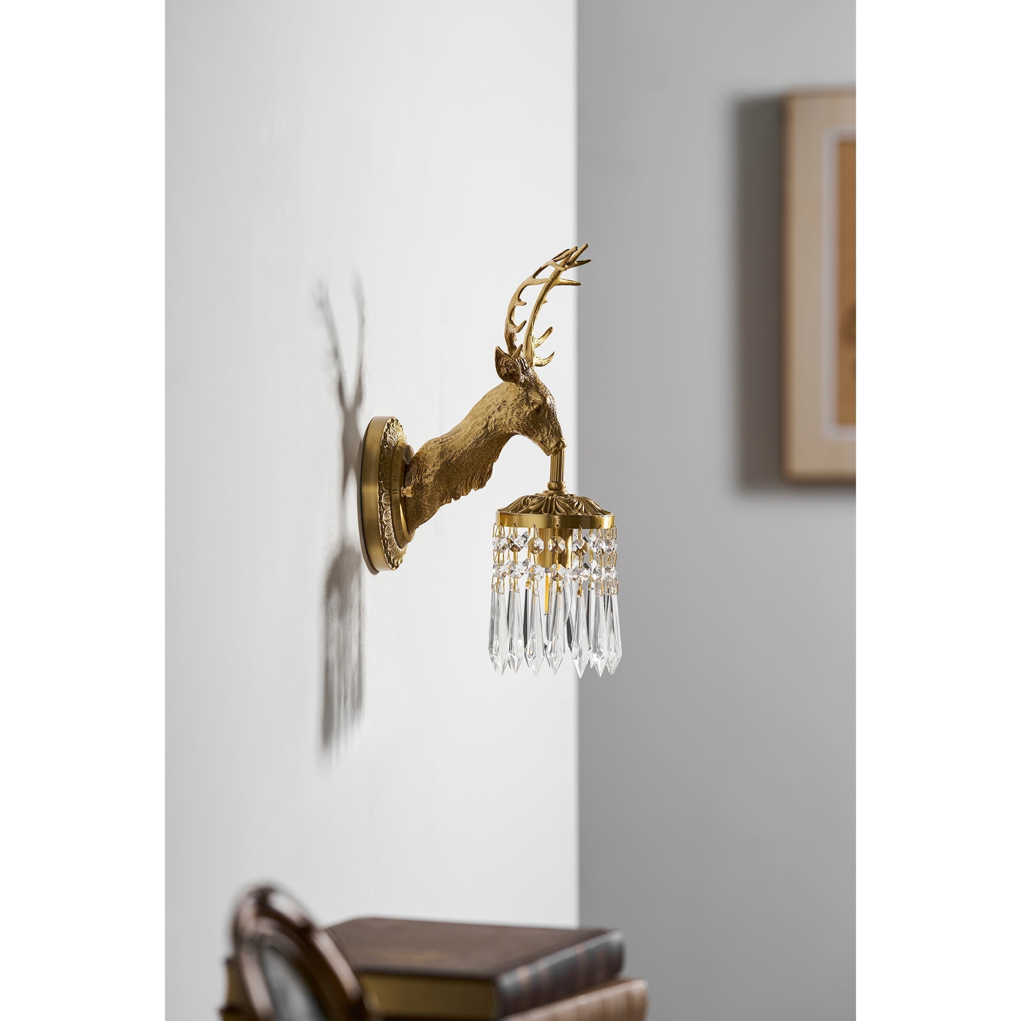 The wall sconce unlit, showcasing its sculptural quality.