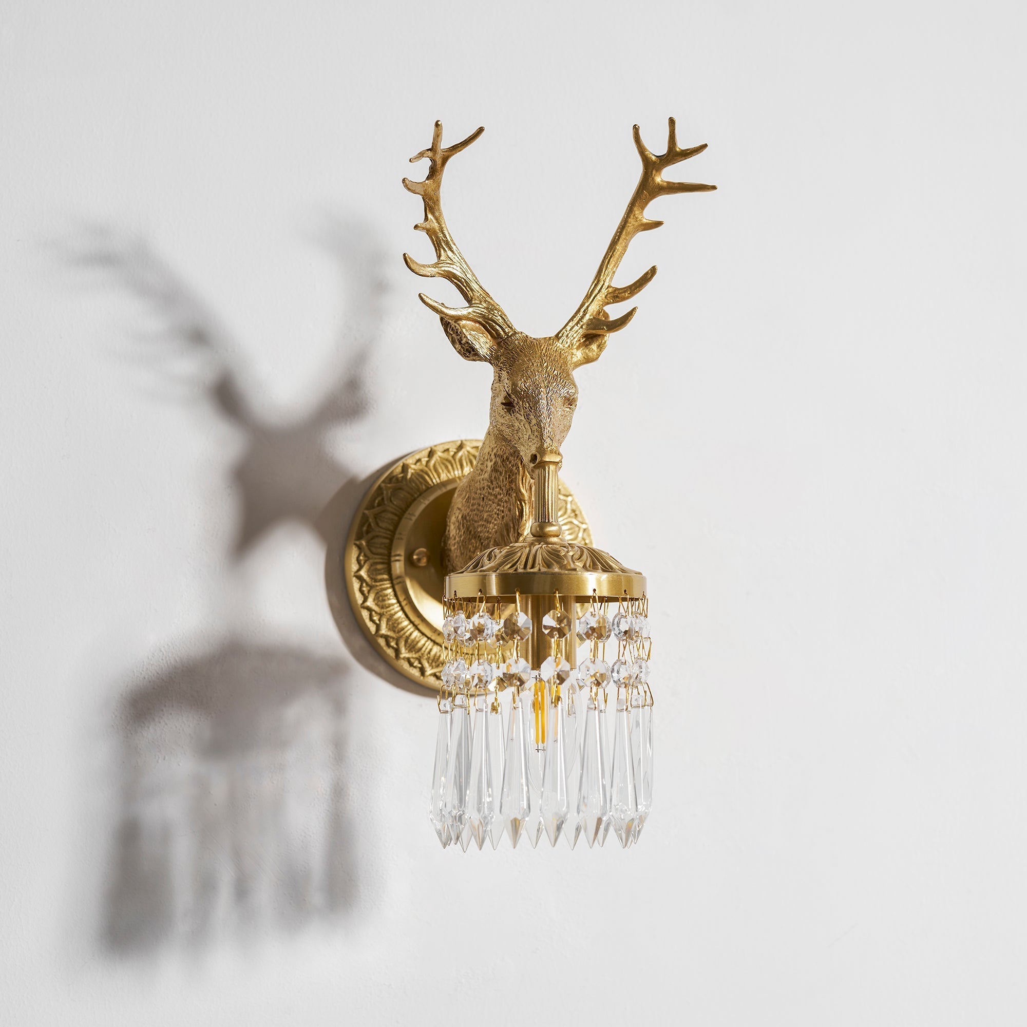 The Antler Crystal Wall Lamp as a decorative art piece.
