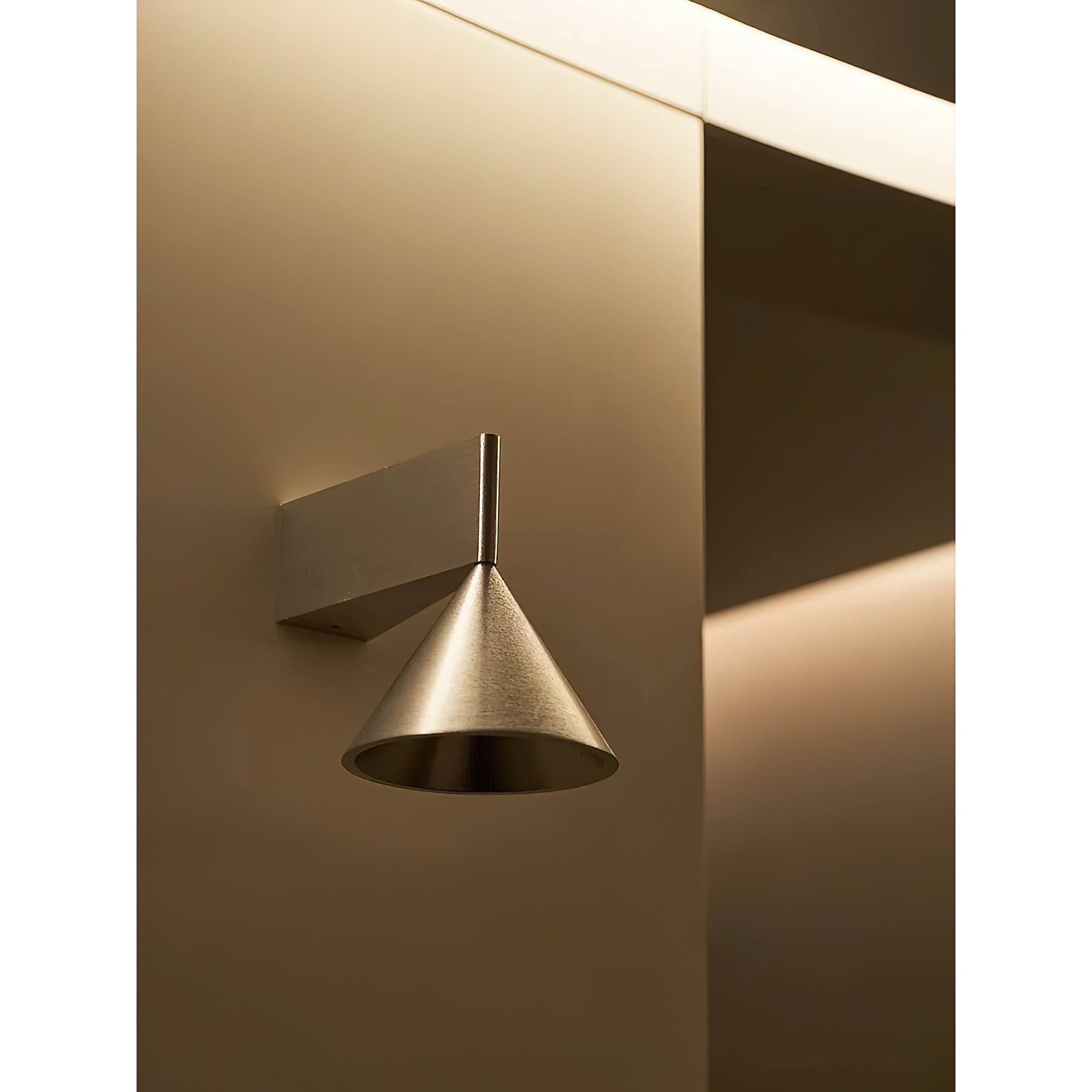 Apollo Wall Lamp in a contemporary bedroom setting.