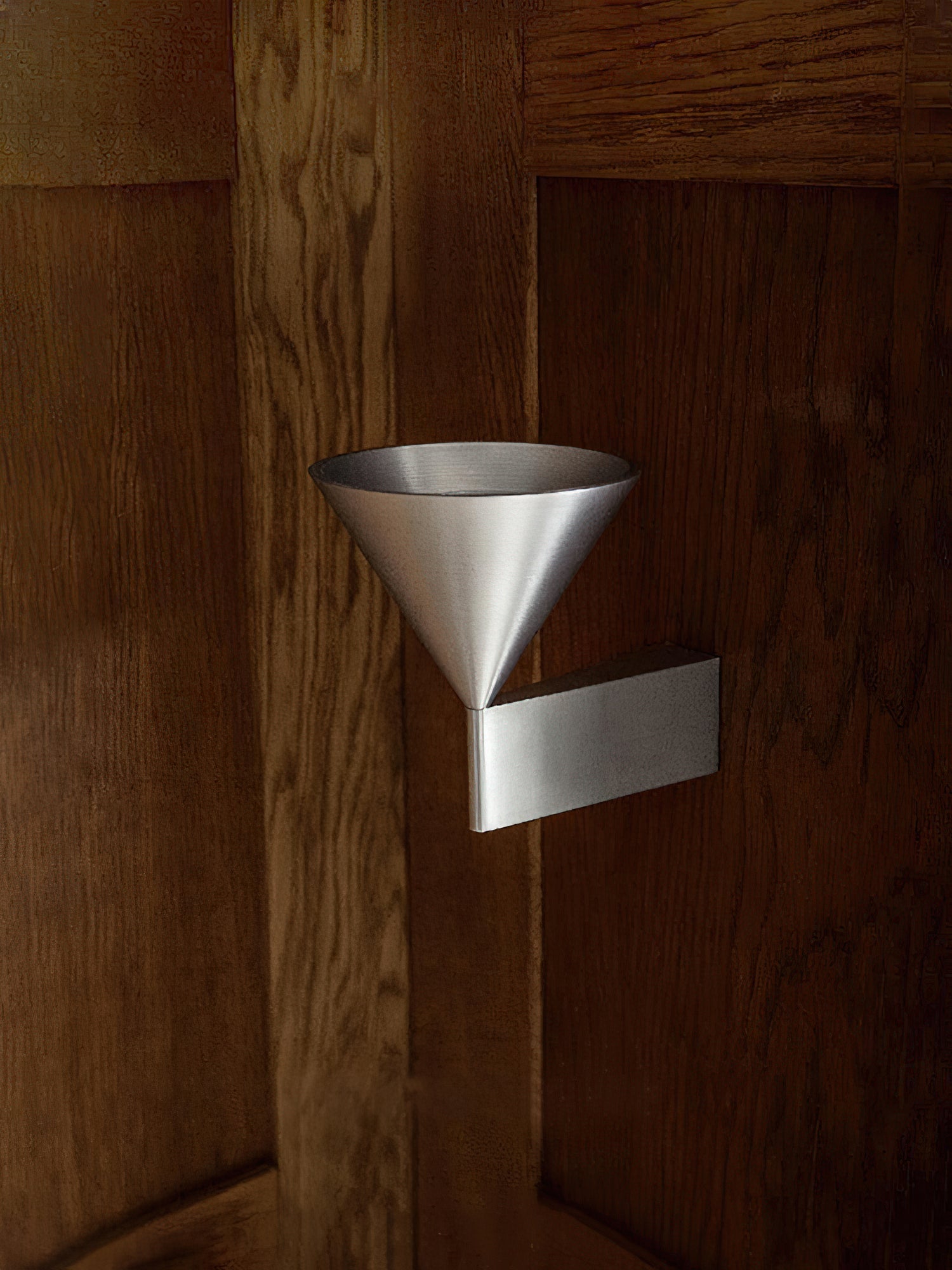 Apollo Wall Lamp shown with downward lighting effect on a wall.