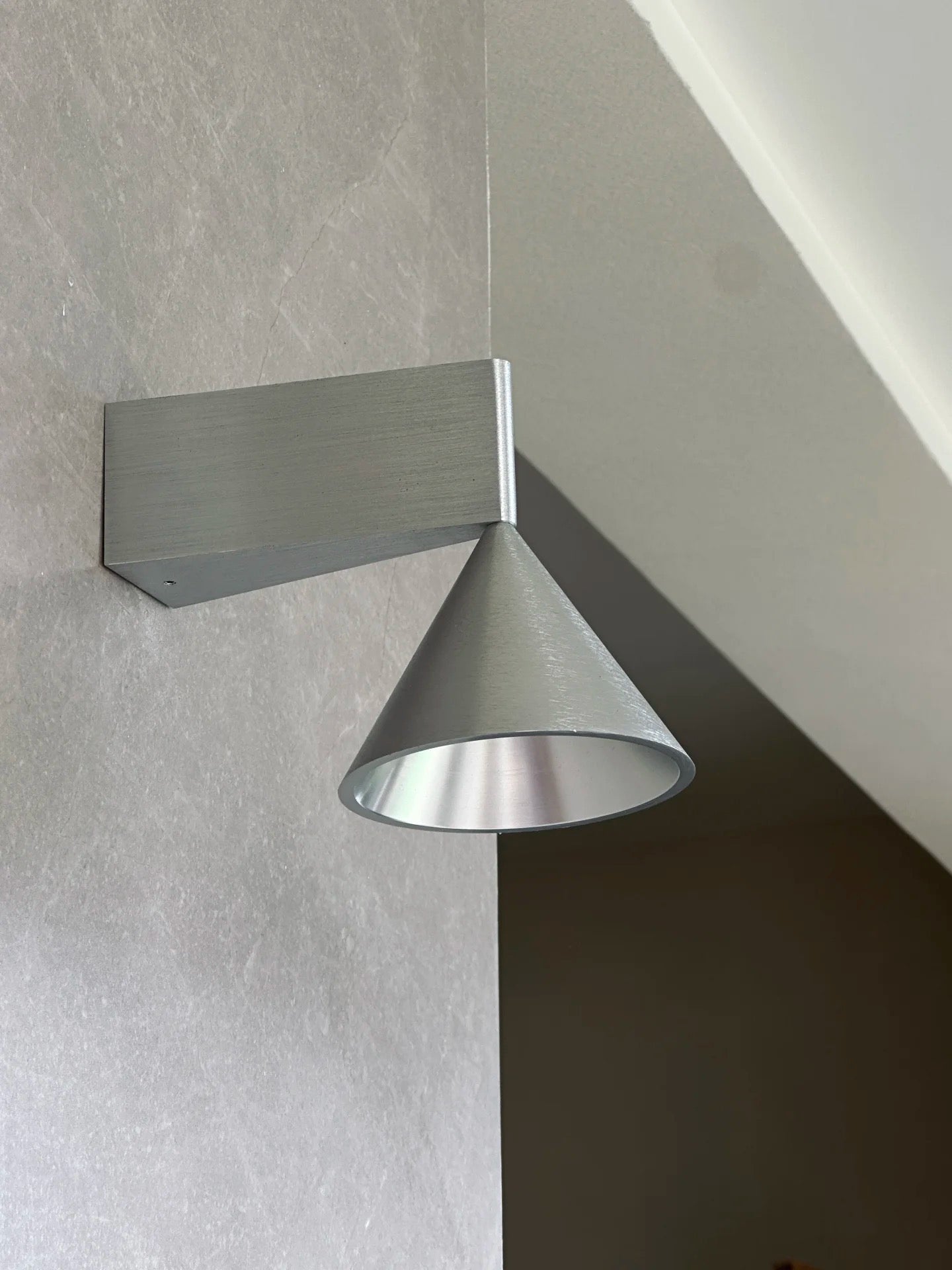 Lifestyle image of the Apollo Wall Lamp in a modern living room.