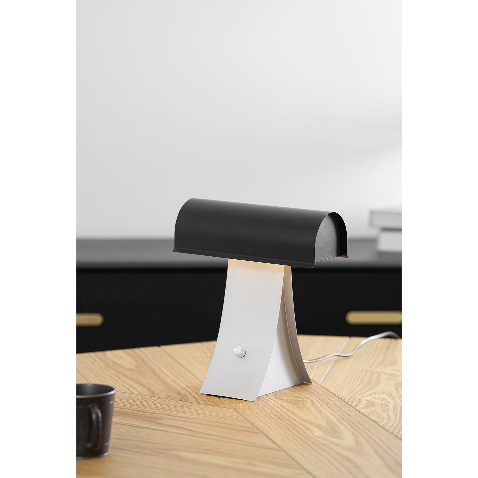 Lifestyle image featuring the lamp in a creative studio.