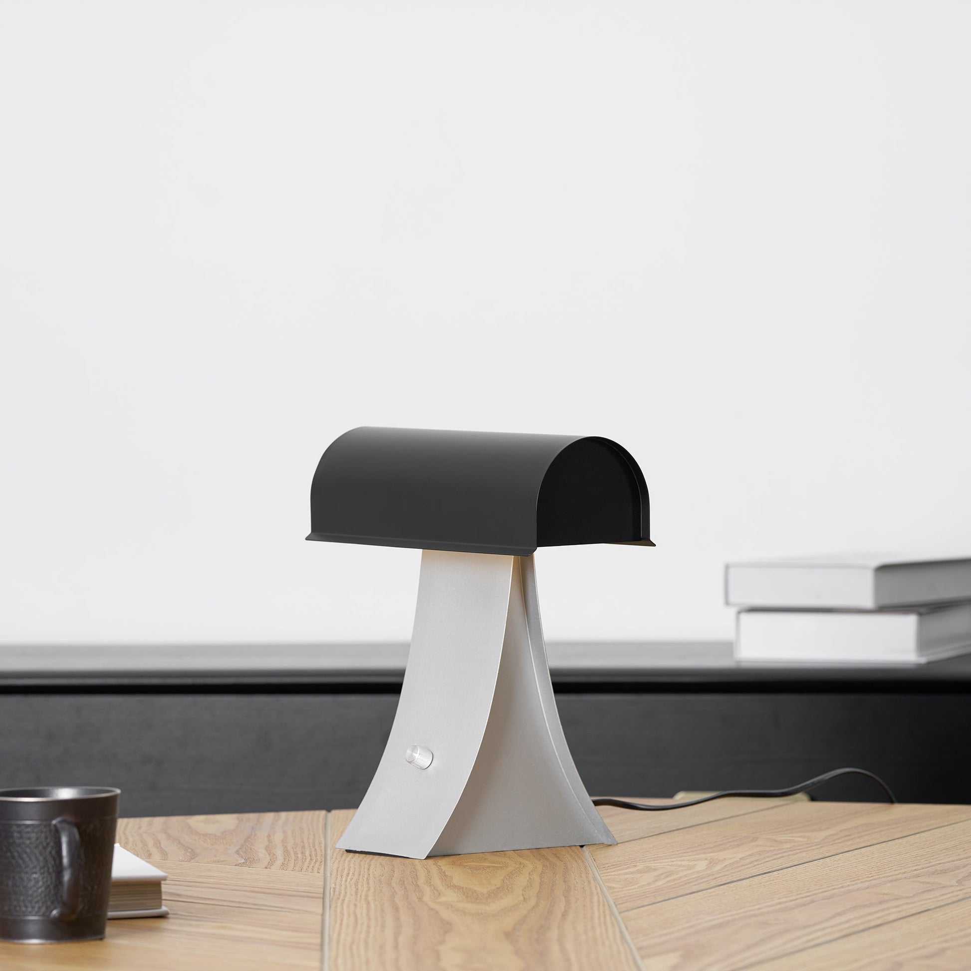 The lamp displayed on a side table in a living room.