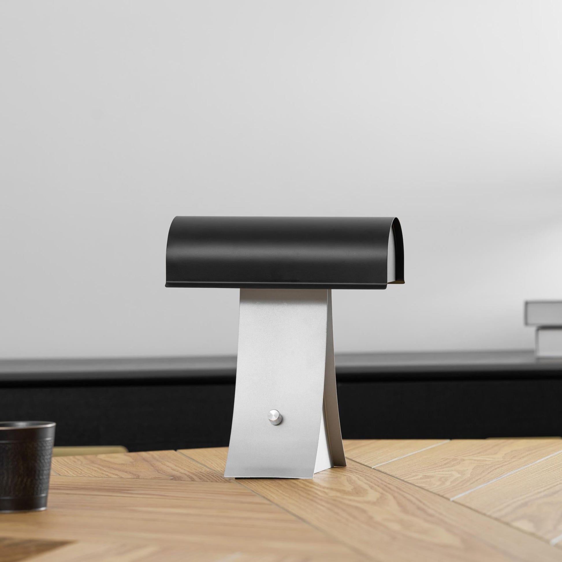 The integrated LED light source of the Archive Table Lamp.