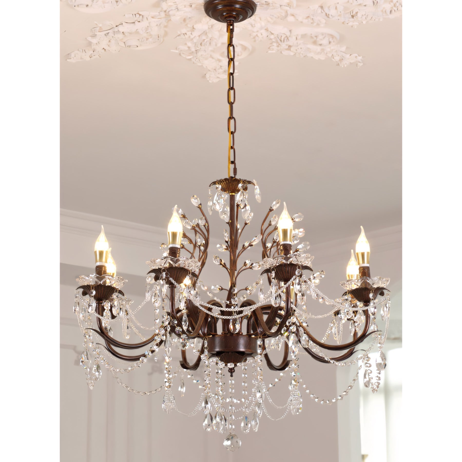A single crystal teardrop from the chandelier refracting light.