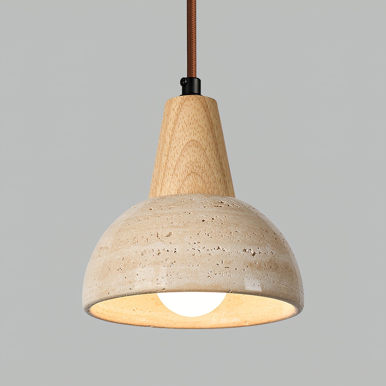 The Arluoe Pendant Lamp displayed in a cozy corner, highlighting its earthy aesthetic.