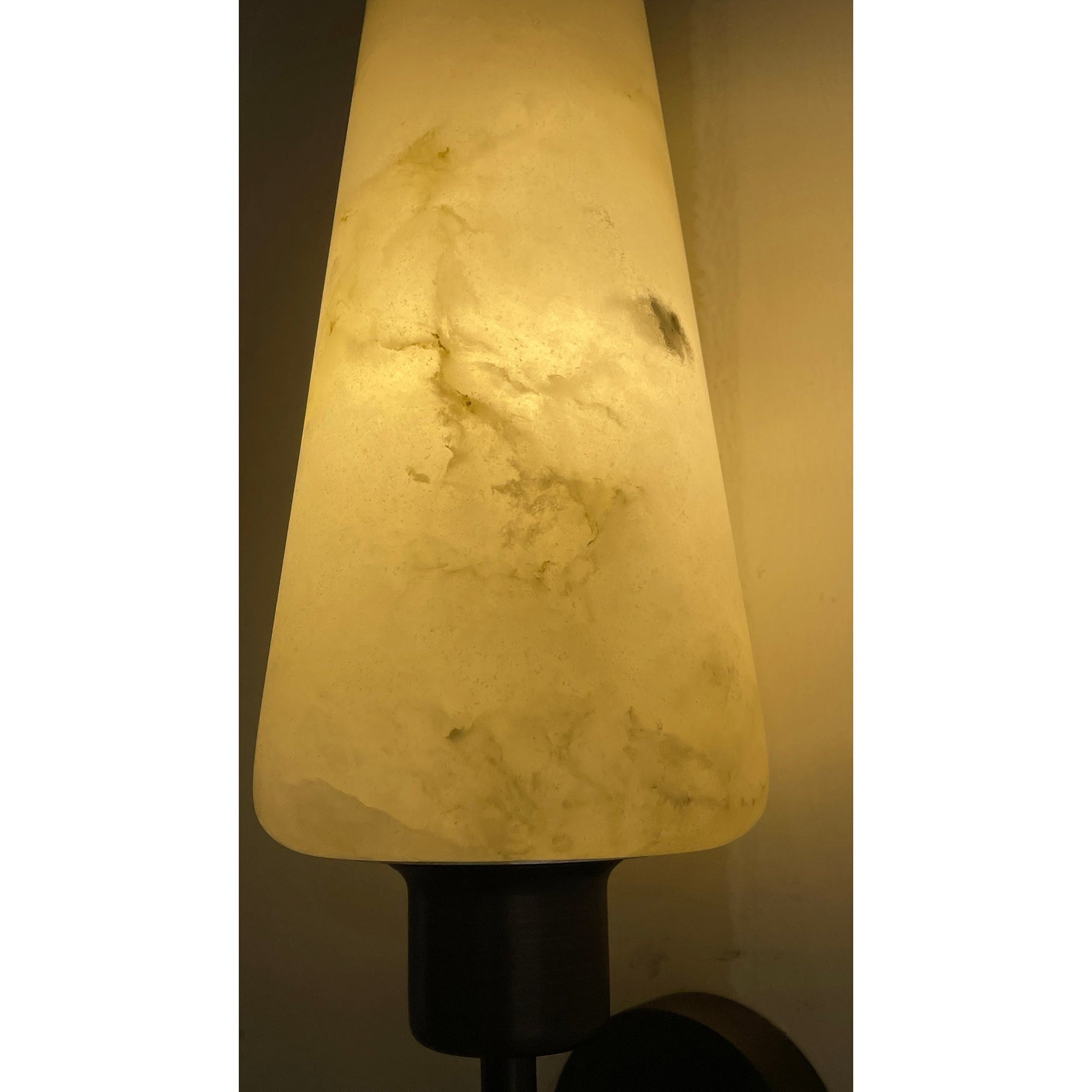 The alabaster shade unlit, showcasing its white and grey veining.
