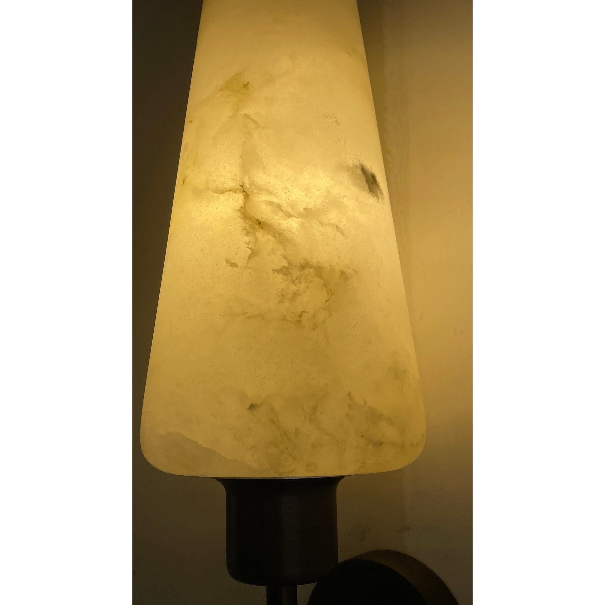 The alabaster shade unlit, showcasing its white and grey veining.