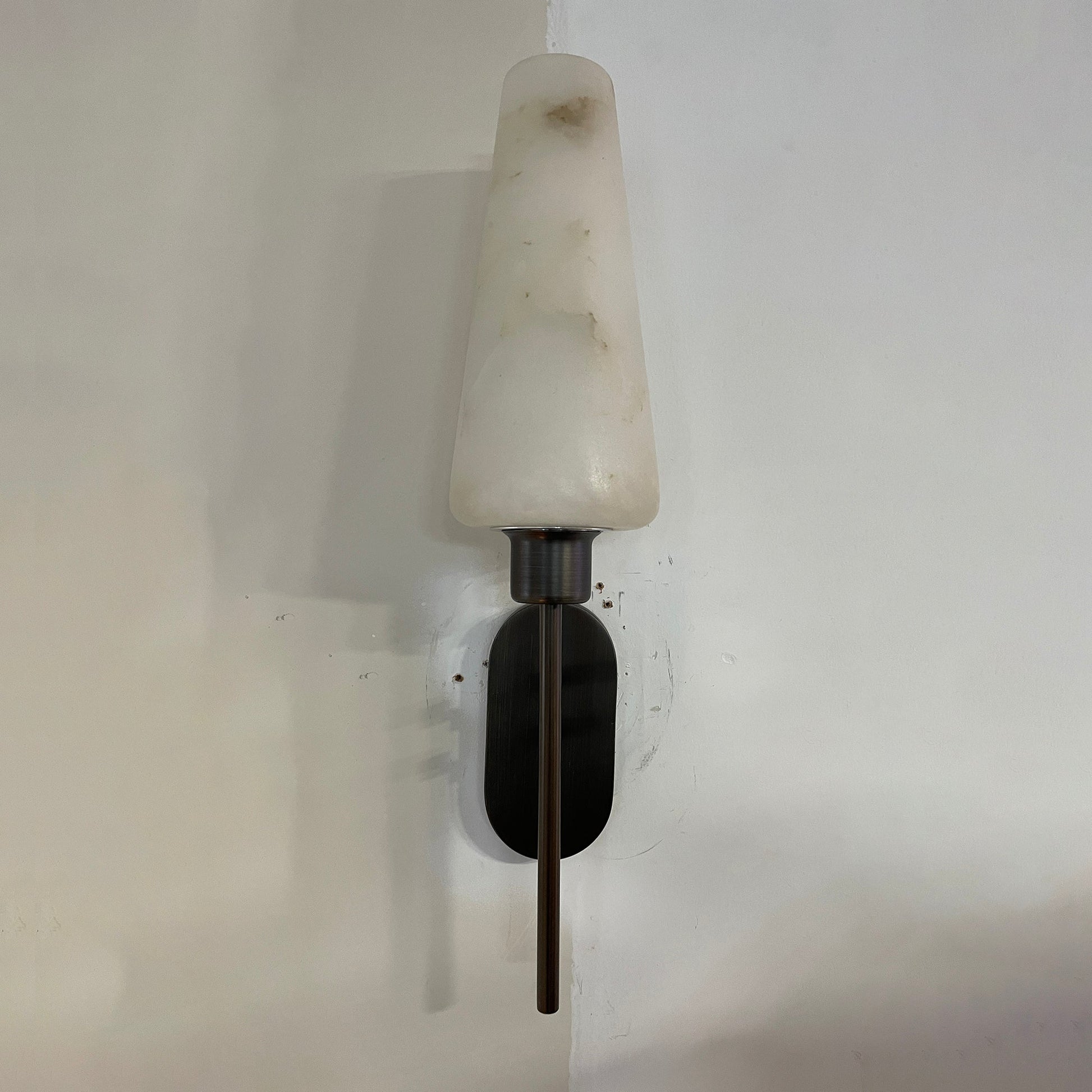 Side profile of the wall lamp, showing its depth and structure.