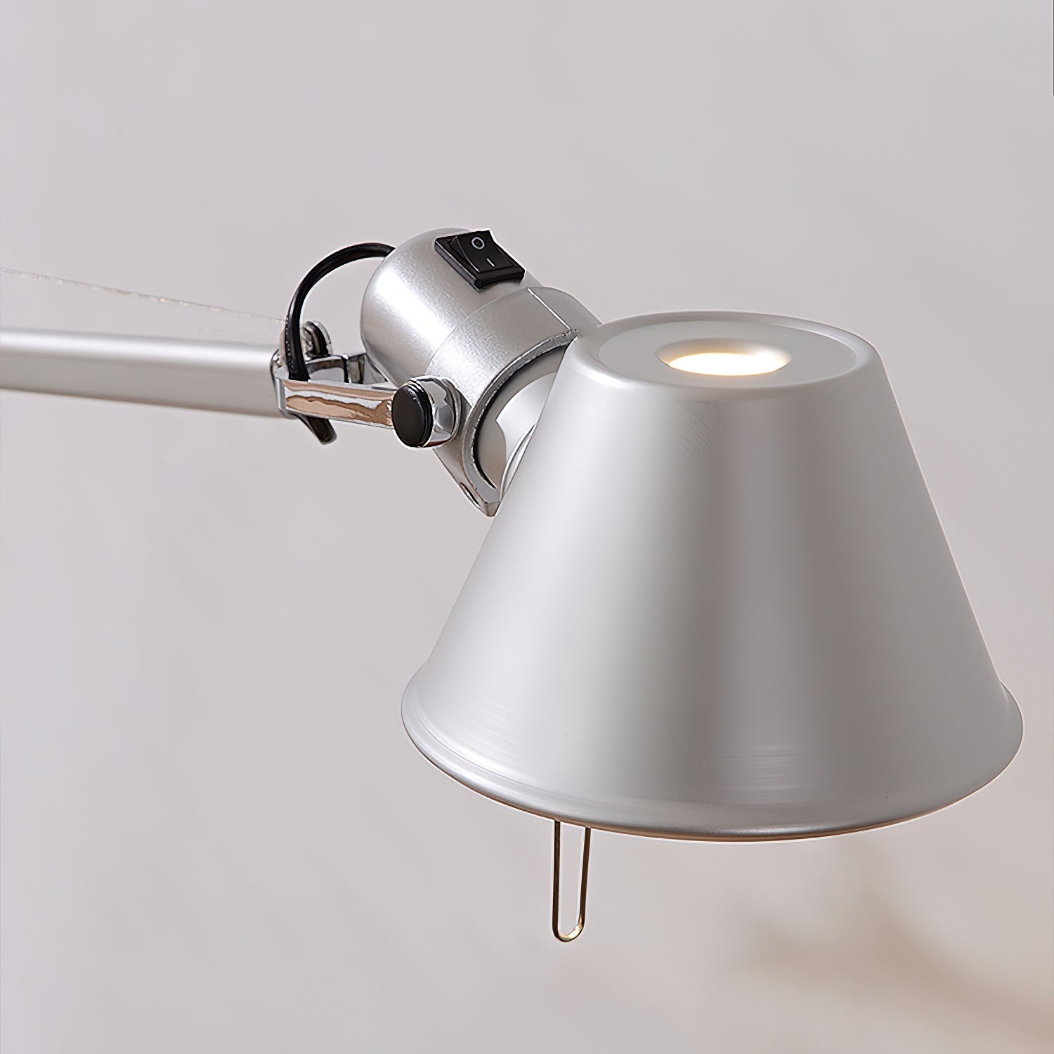A lifestyle image showing the lamp in a modern study.