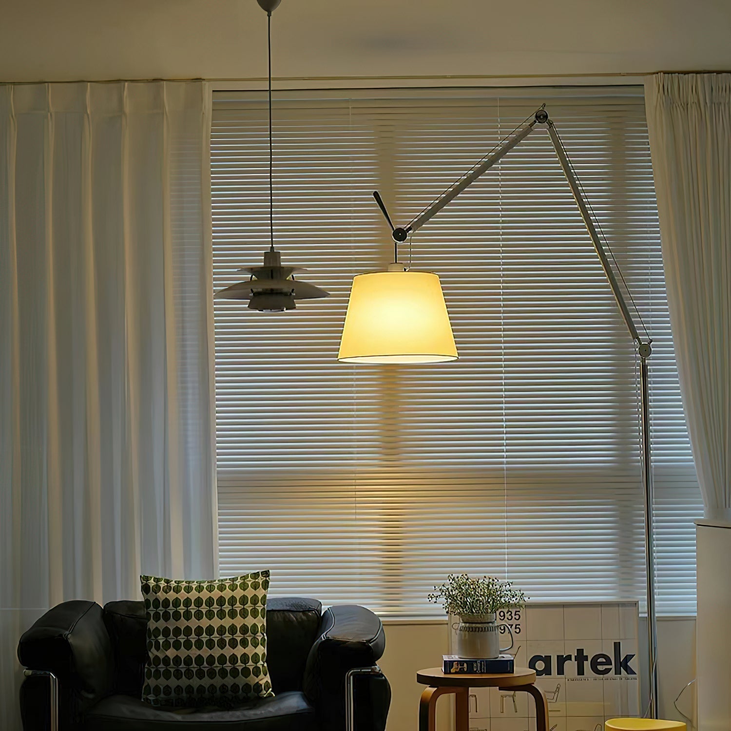 Costanza Floor Lamp shown in a study next to a desk.