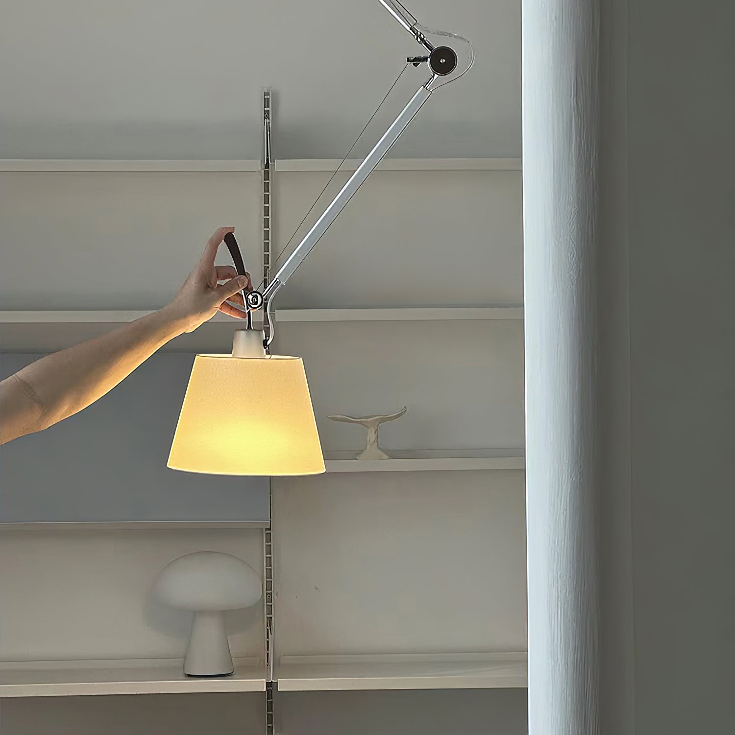 Beige Costanza Pendant Lamp over a round wooden dining table.