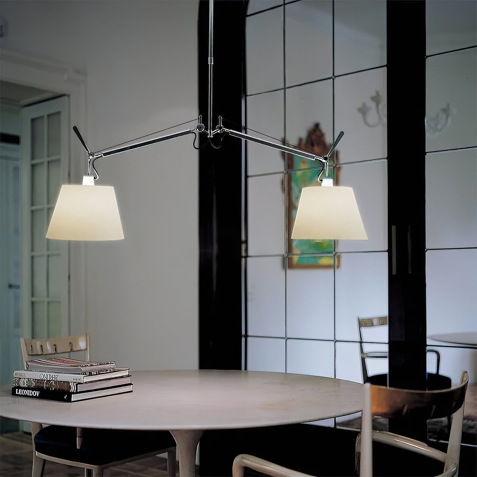 Costanza Pendant Lamp in silver, casting a focused pool of light.