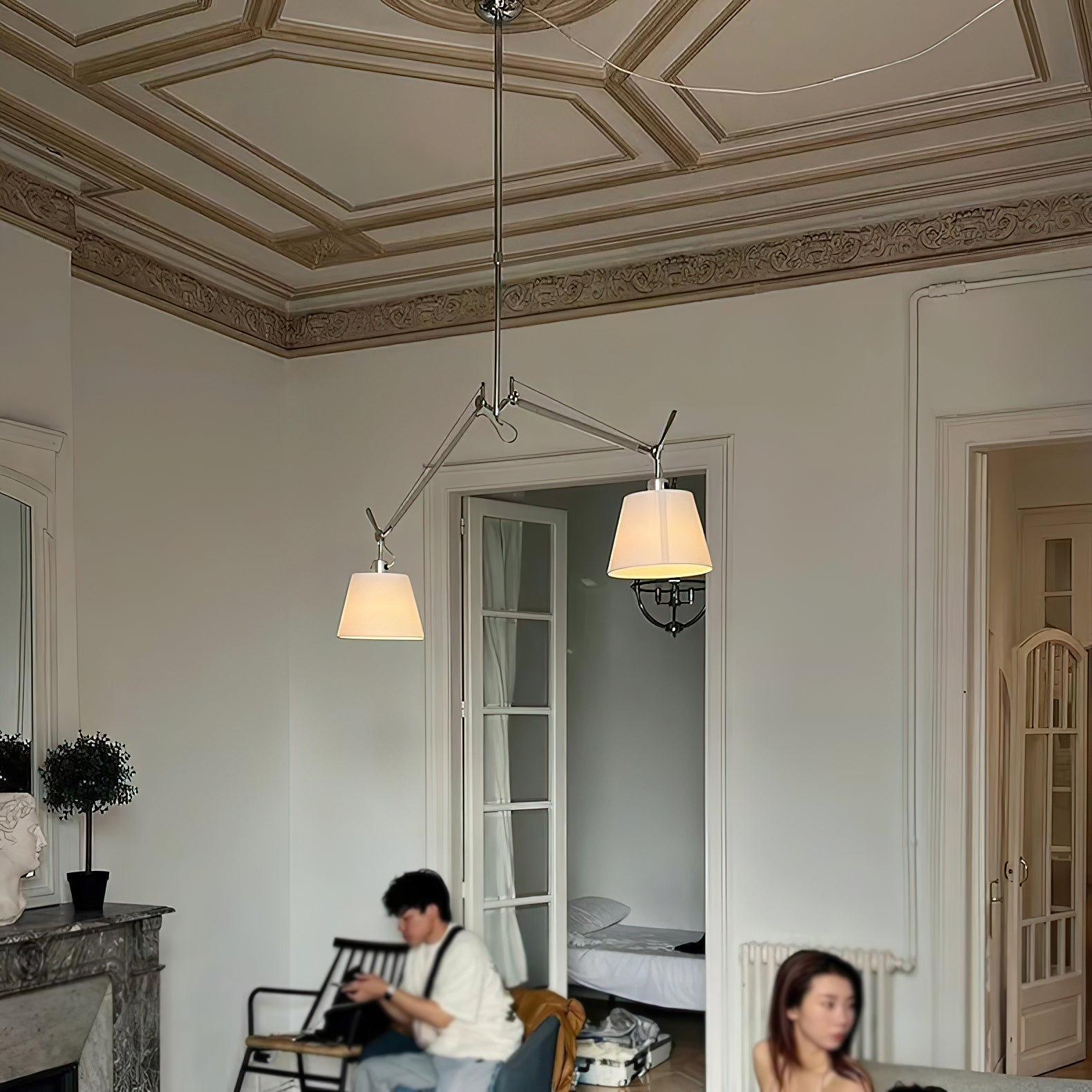 The texture of the white fabric shade on the Costanza lamp.