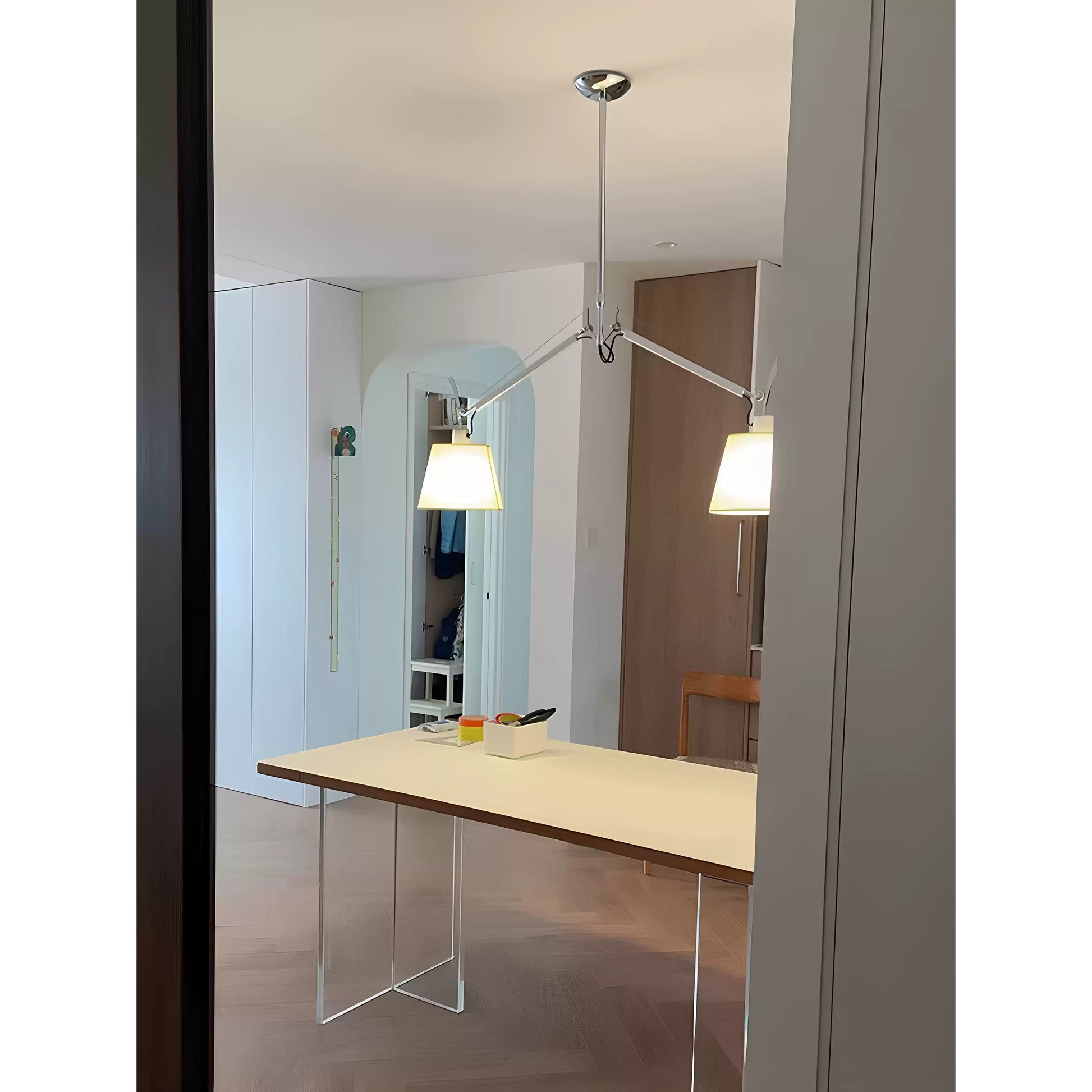 The sleek aluminum body of the silver Costanza Pendant Lamp.