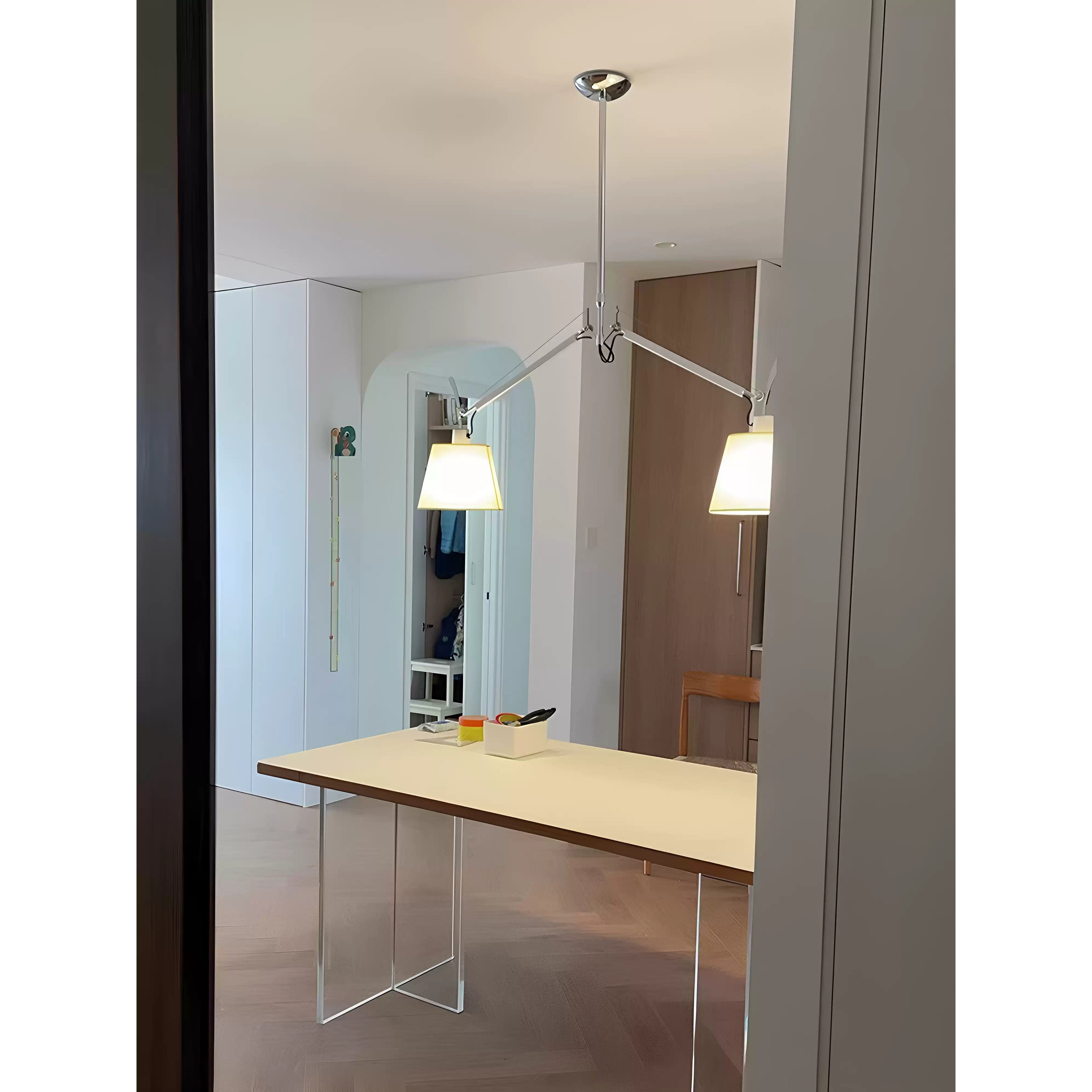 The sleek aluminum body of the silver Costanza Pendant Lamp.