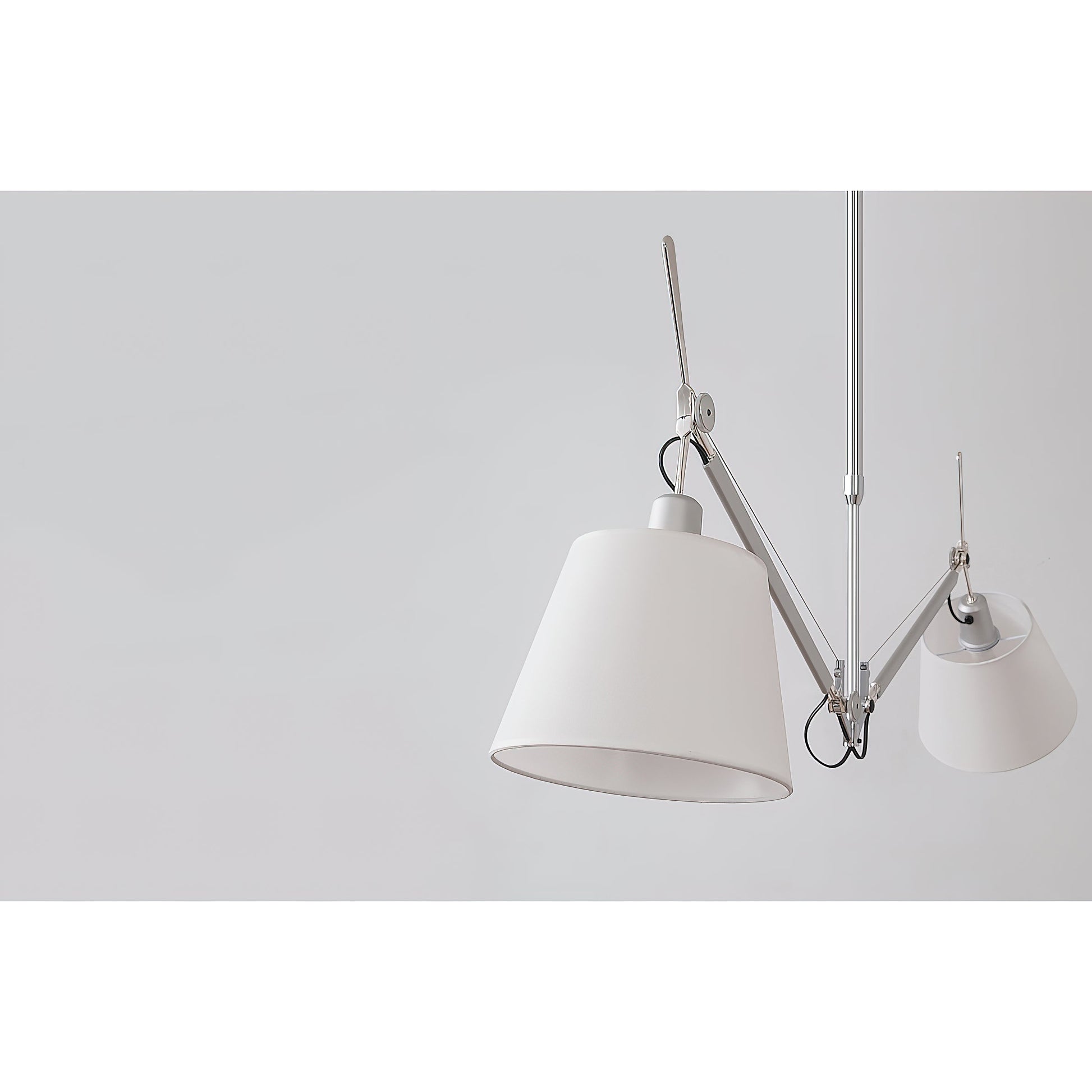 The two-head lamp in a commercial setting like a cafe.