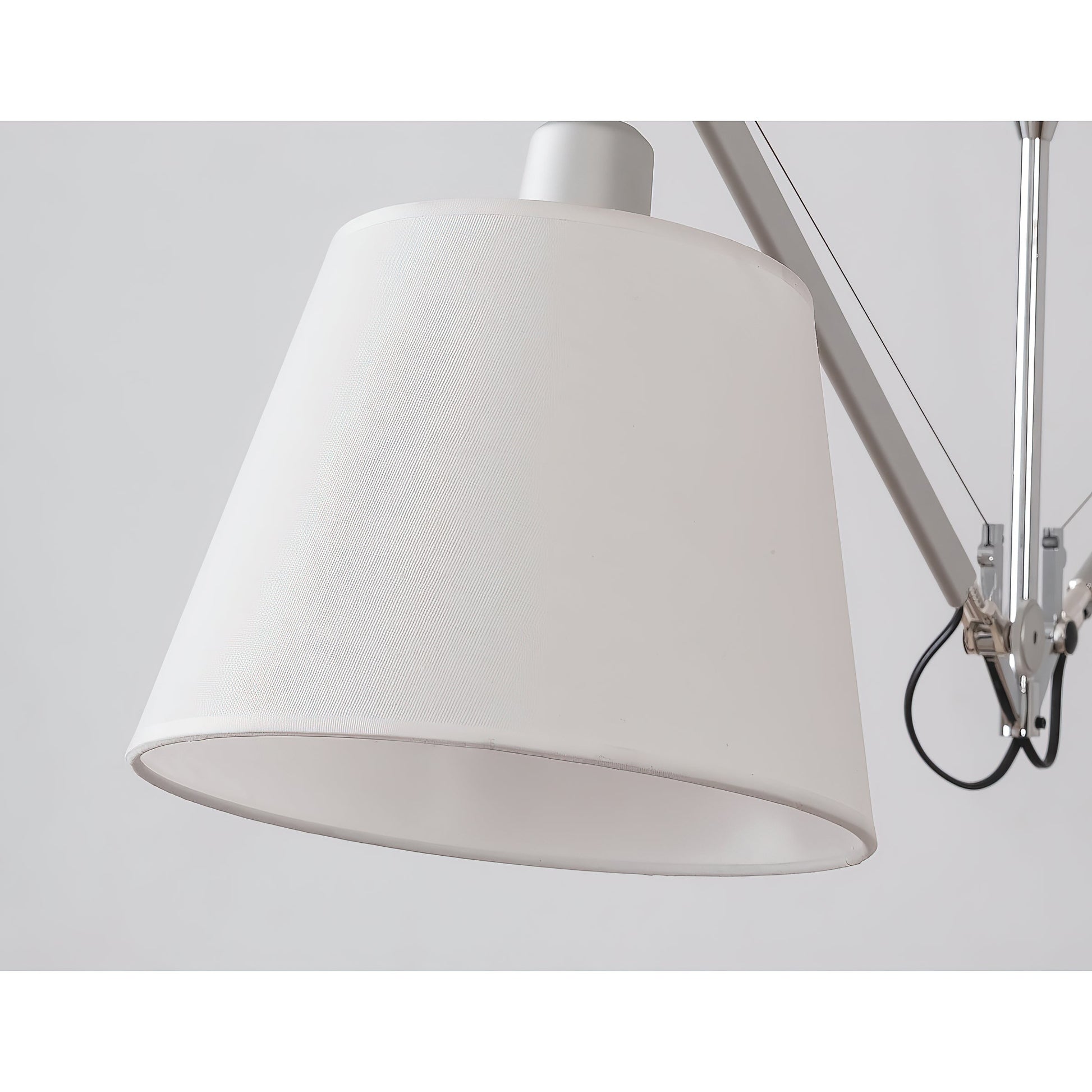 The white Costanza lamp in a Scandinavian-style living room.