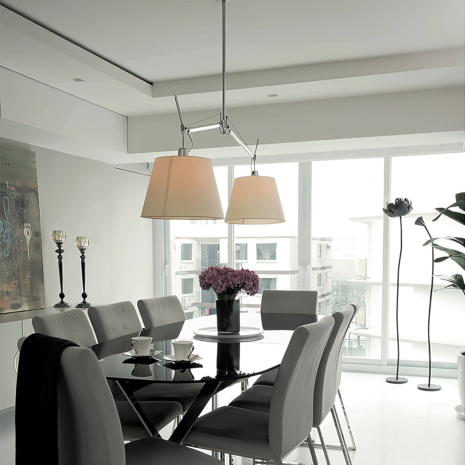 The Costanza Pendant Lamp in white, illuminating a home office desk.