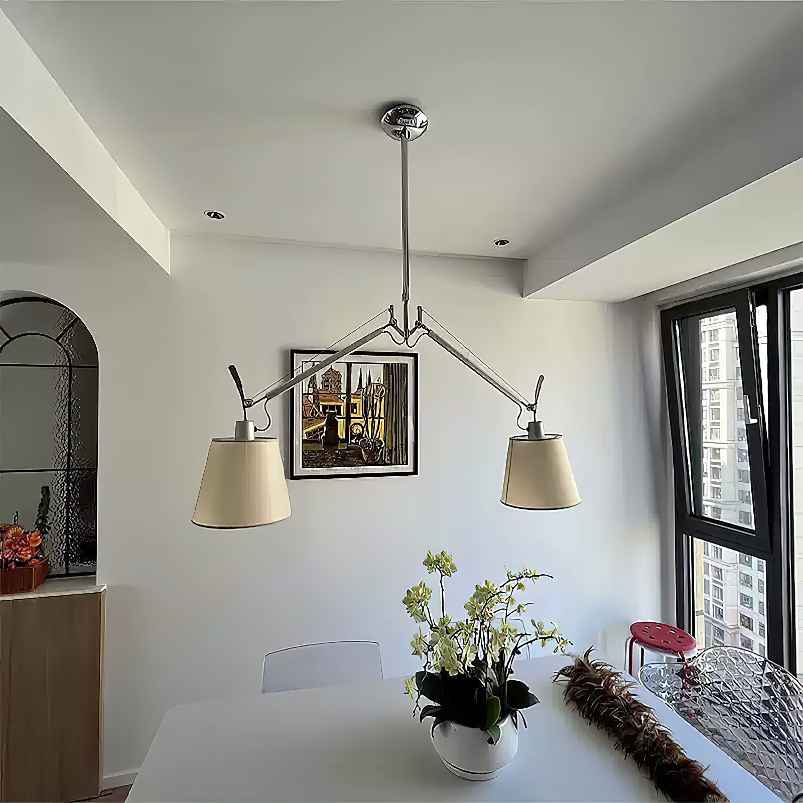 The two-head Costanza lamp shown in a creative studio space.