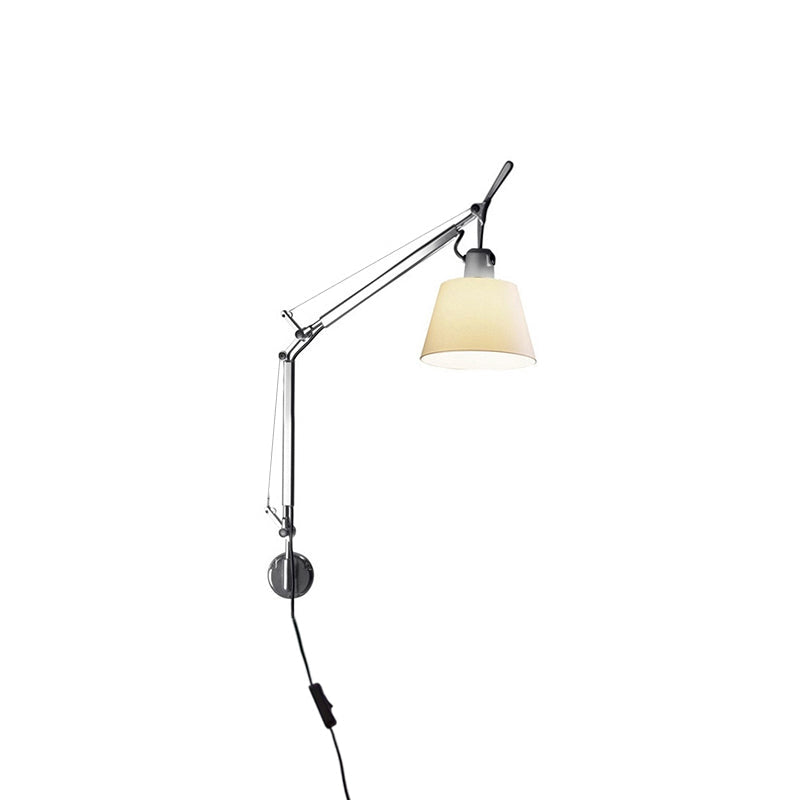 The lamp folded flat against the wall to save space.
