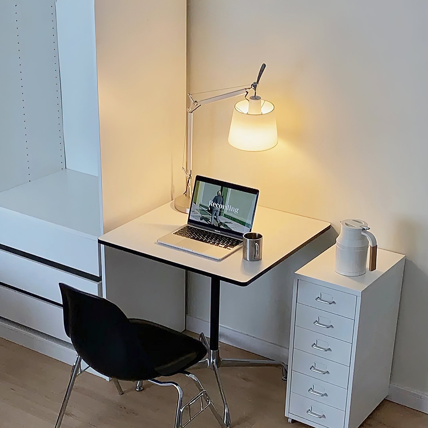 The lamp shown on a nightstand in a contemporary bedroom setting.