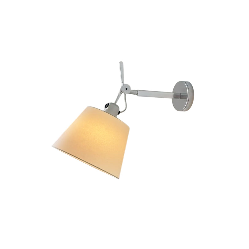 Costanza arm wall lamp with a silver aluminum body and fabric shade.