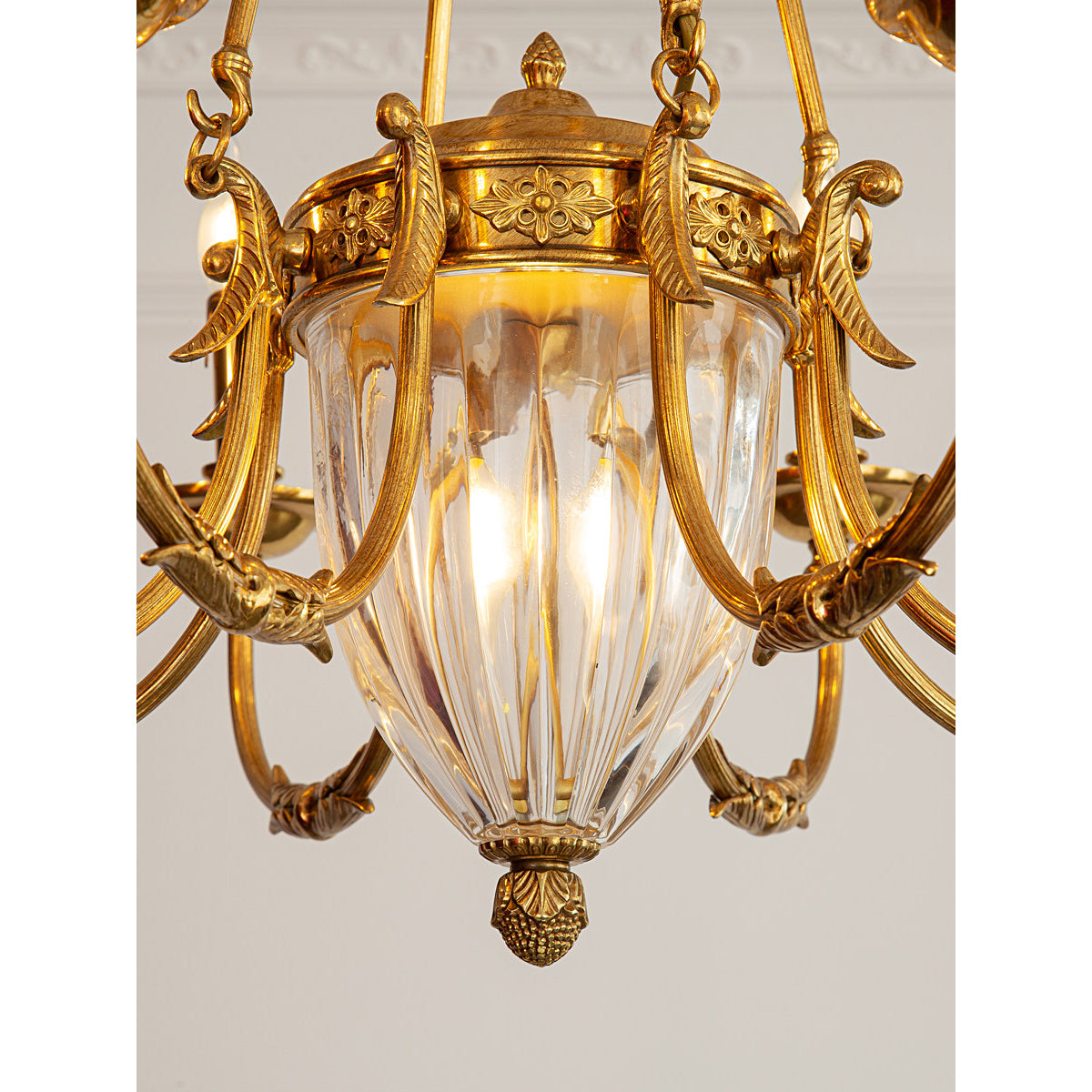The Ashford Chandelier hanging in a grand foyer with high ceilings.