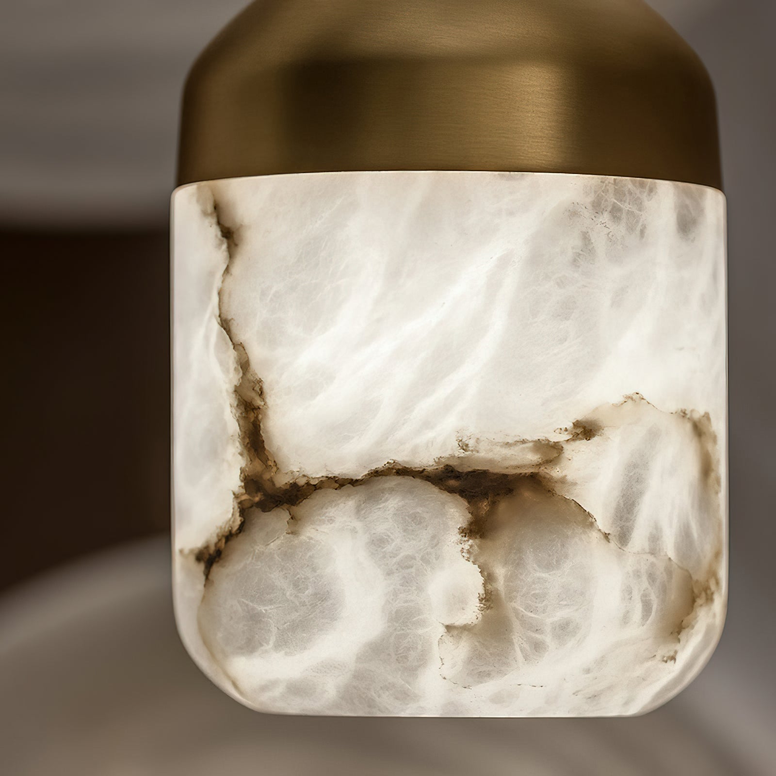The Asta lamp's brass finish in detail.