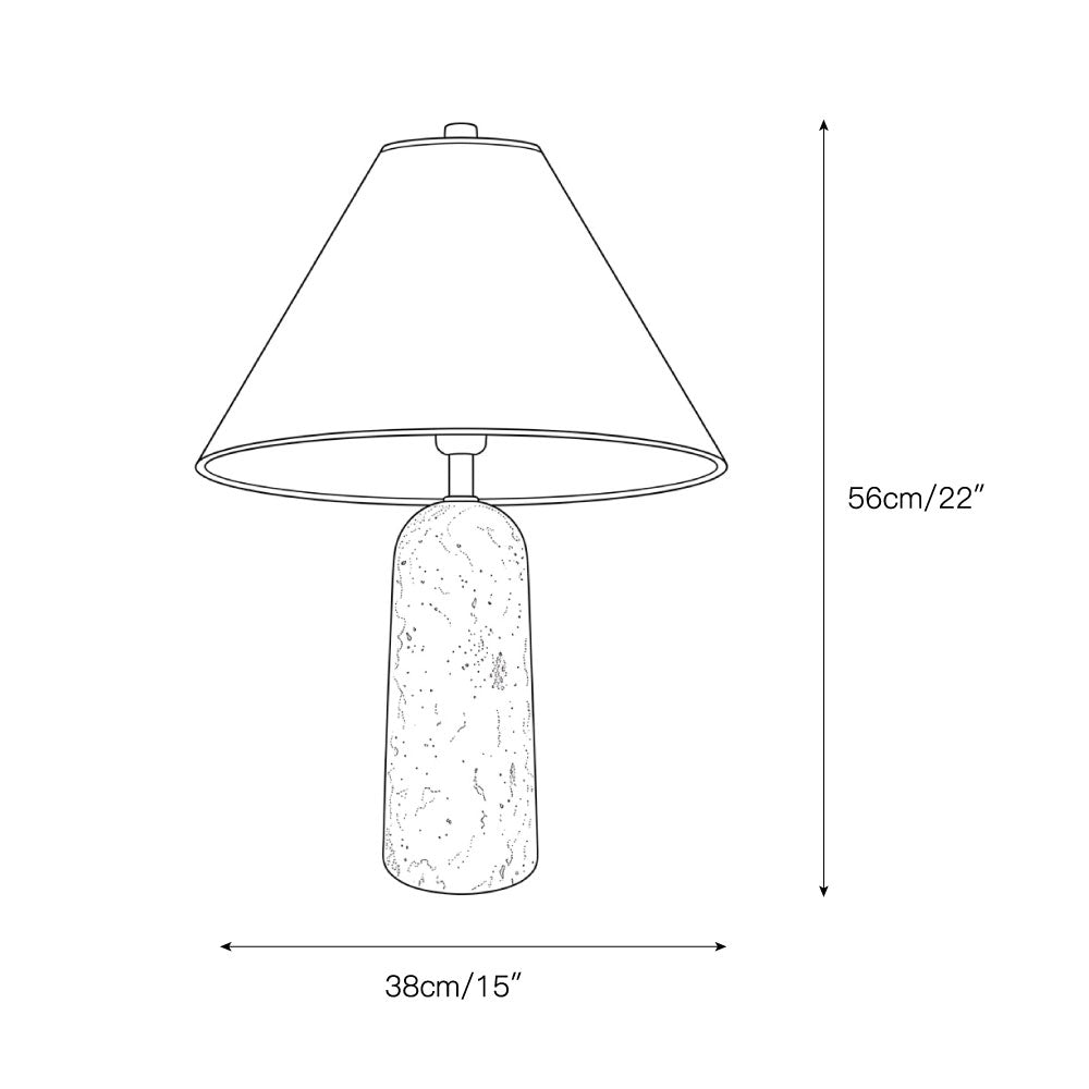 The Astere Table Lamp shown in a minimalist living room setting.