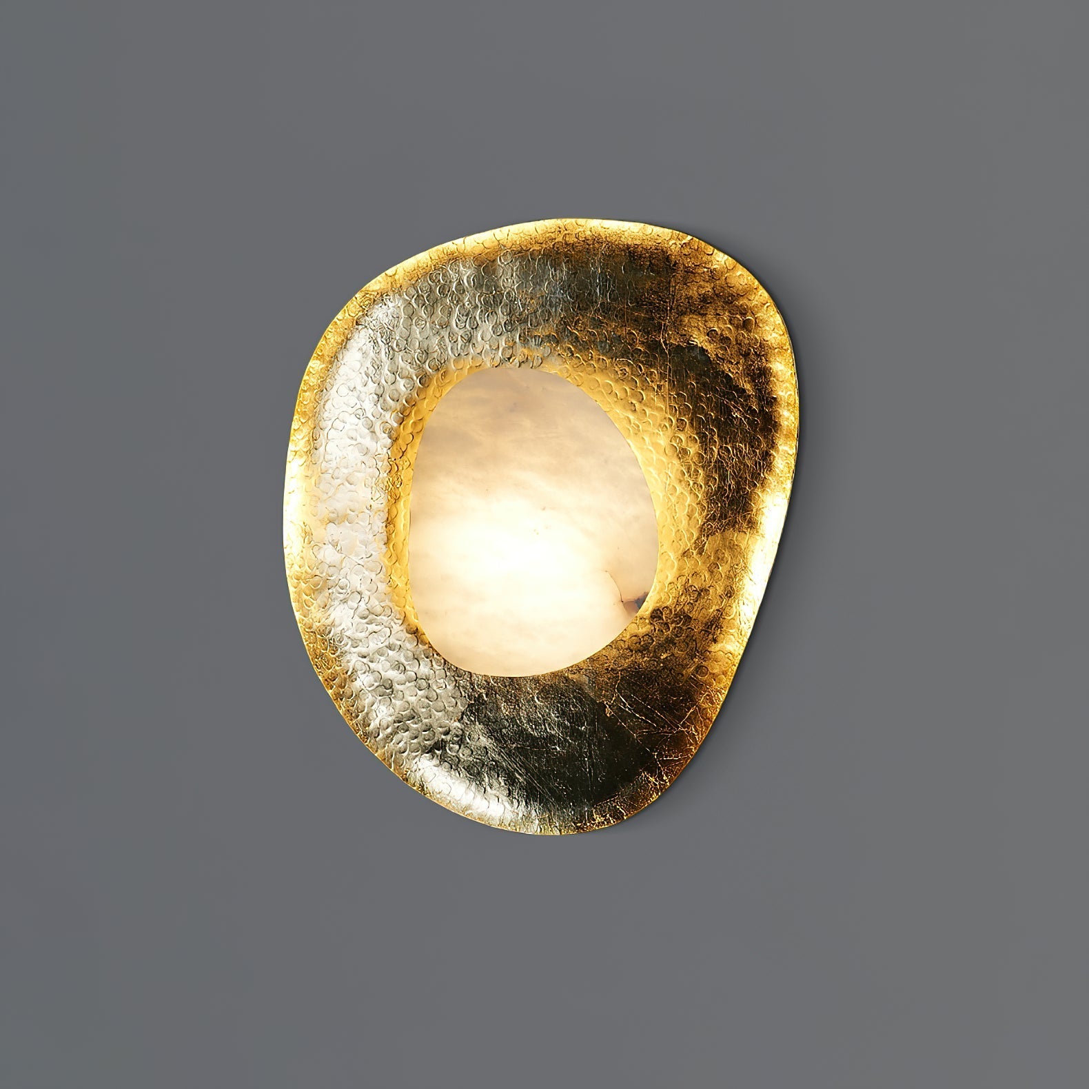 Astoria Sconce shown illuminated, casting a warm and inviting glow.