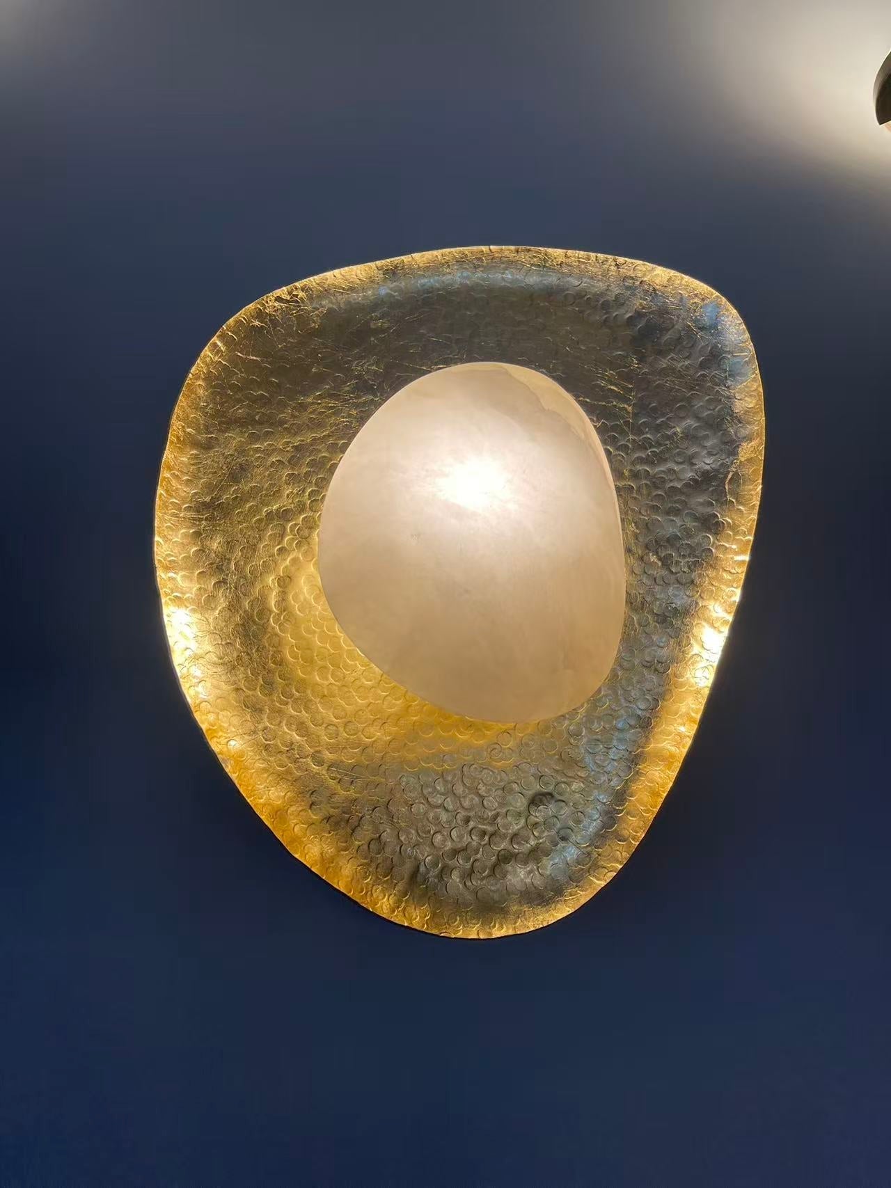 Unlit view of the Astoria Sconce highlighting its material and form.