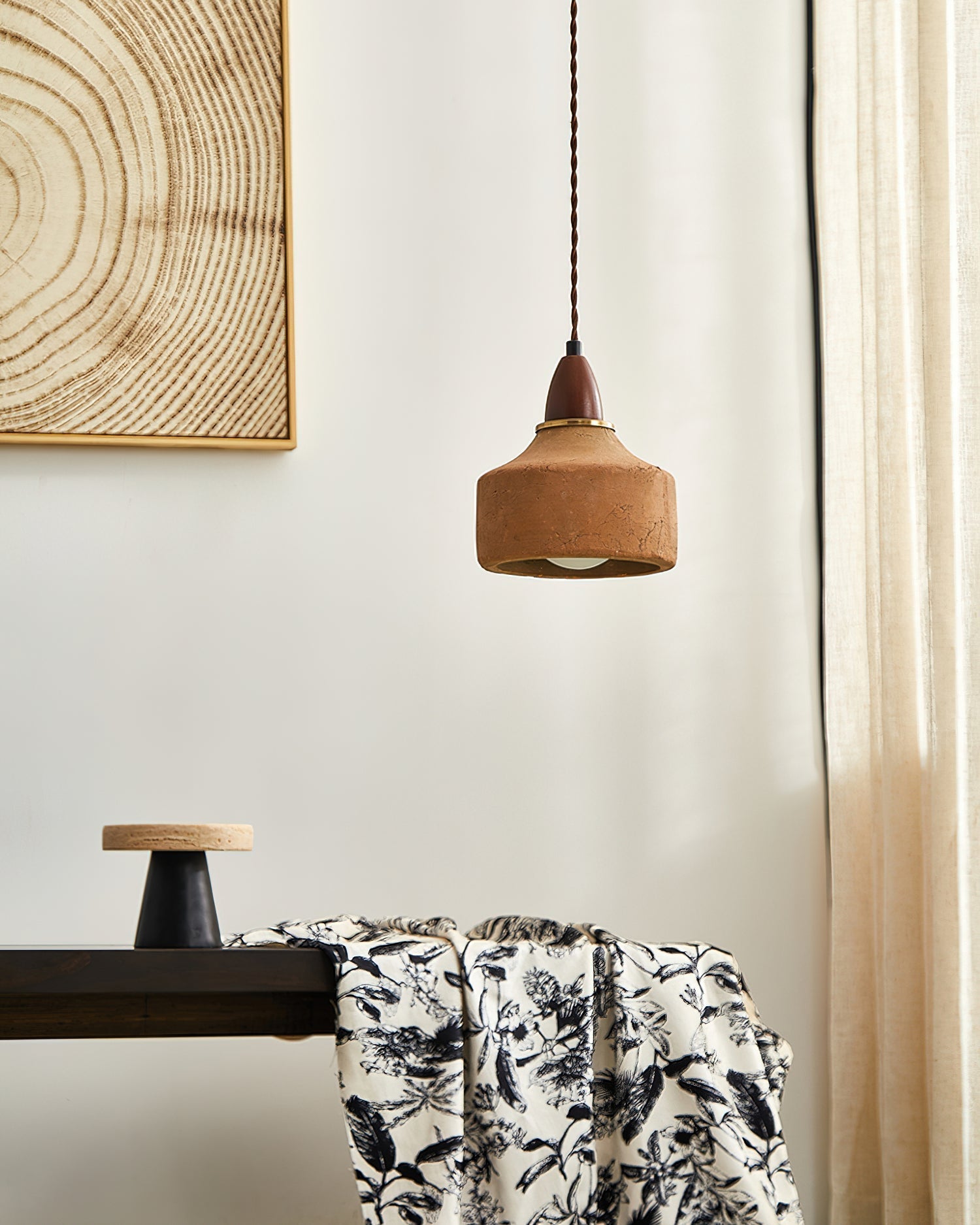 The Auburn Pendant Light hanging over a dining table in a modern home.