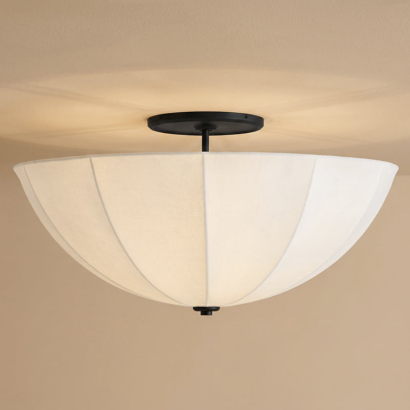 The Auden semi-flush mount in the largest size option, demonstrating its scale.