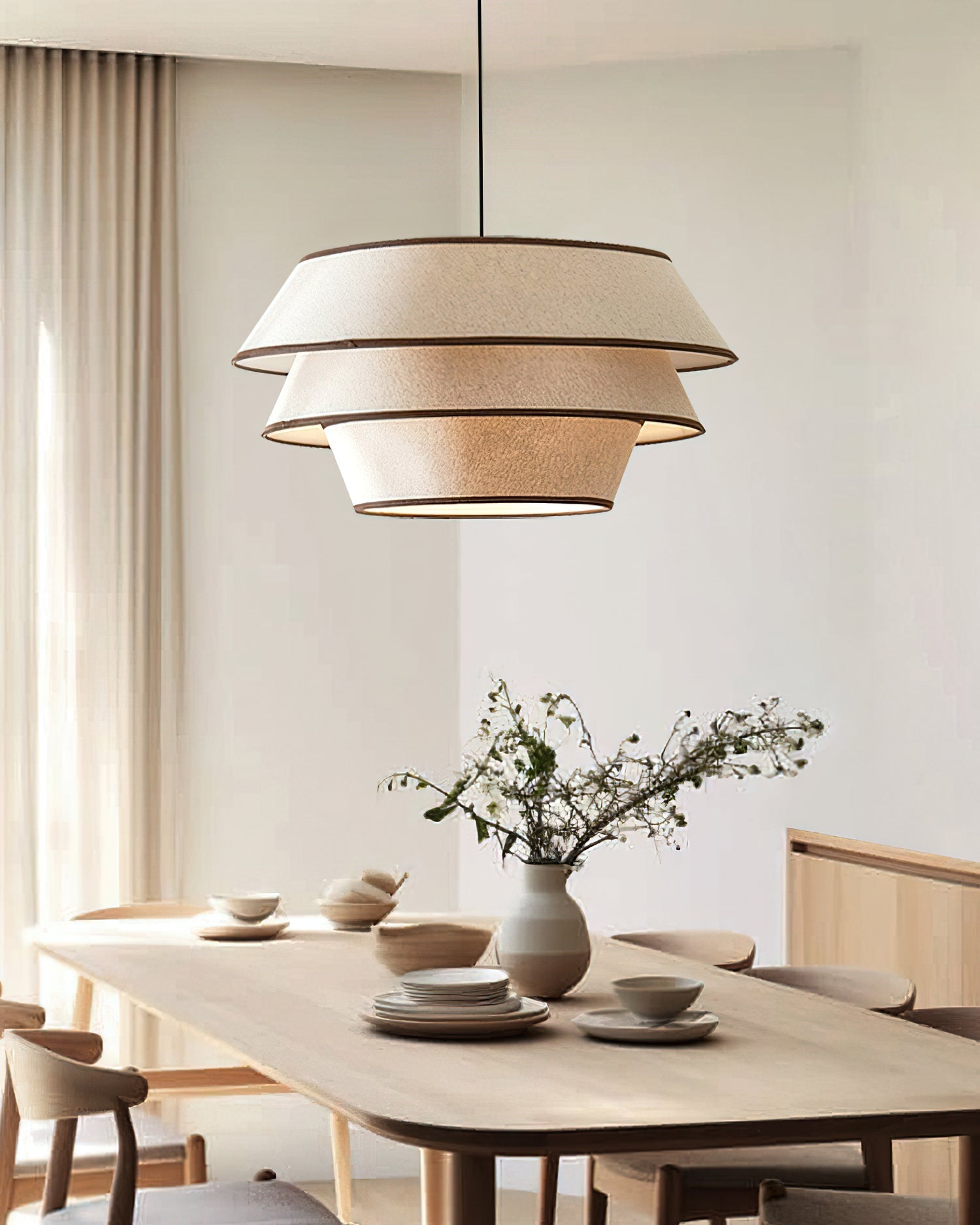 The Auden Pendant Light shown with mid-century modern furniture.