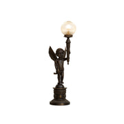 Auguste Moreau style table lamp with a bronze brass base and clear glass shade.