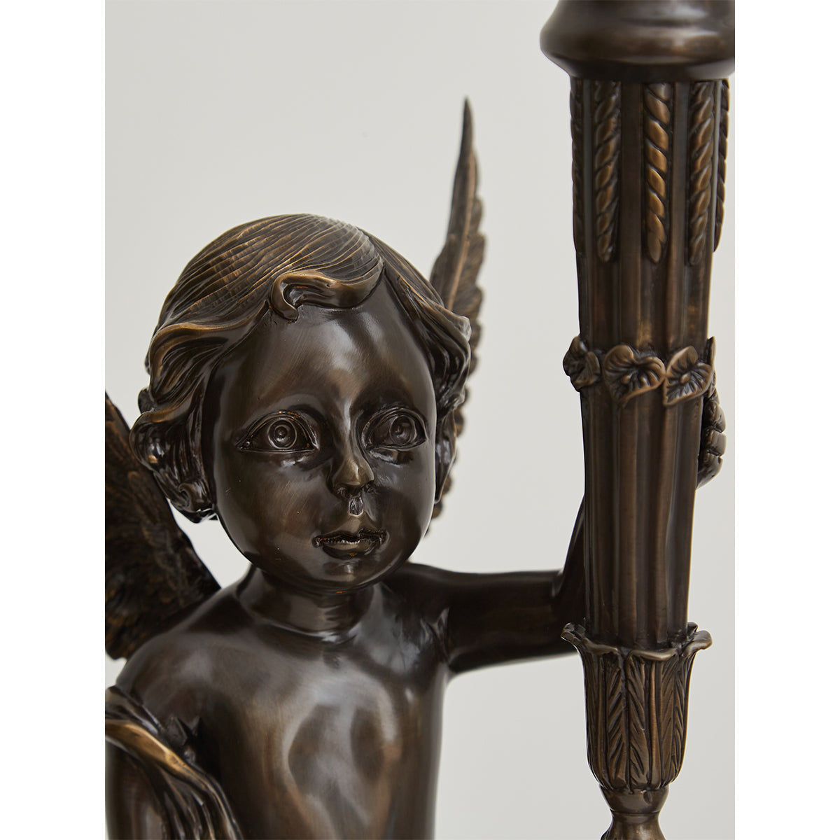 The lamp unlit, showing the contrast between the bronze brass and clear glass.