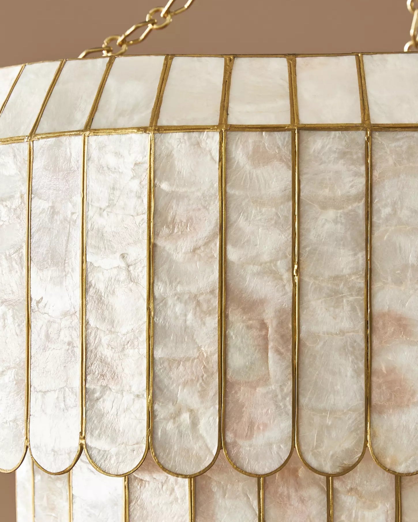 Angled view of the medium-sized Aurelia Capiz Pendant Lamp.