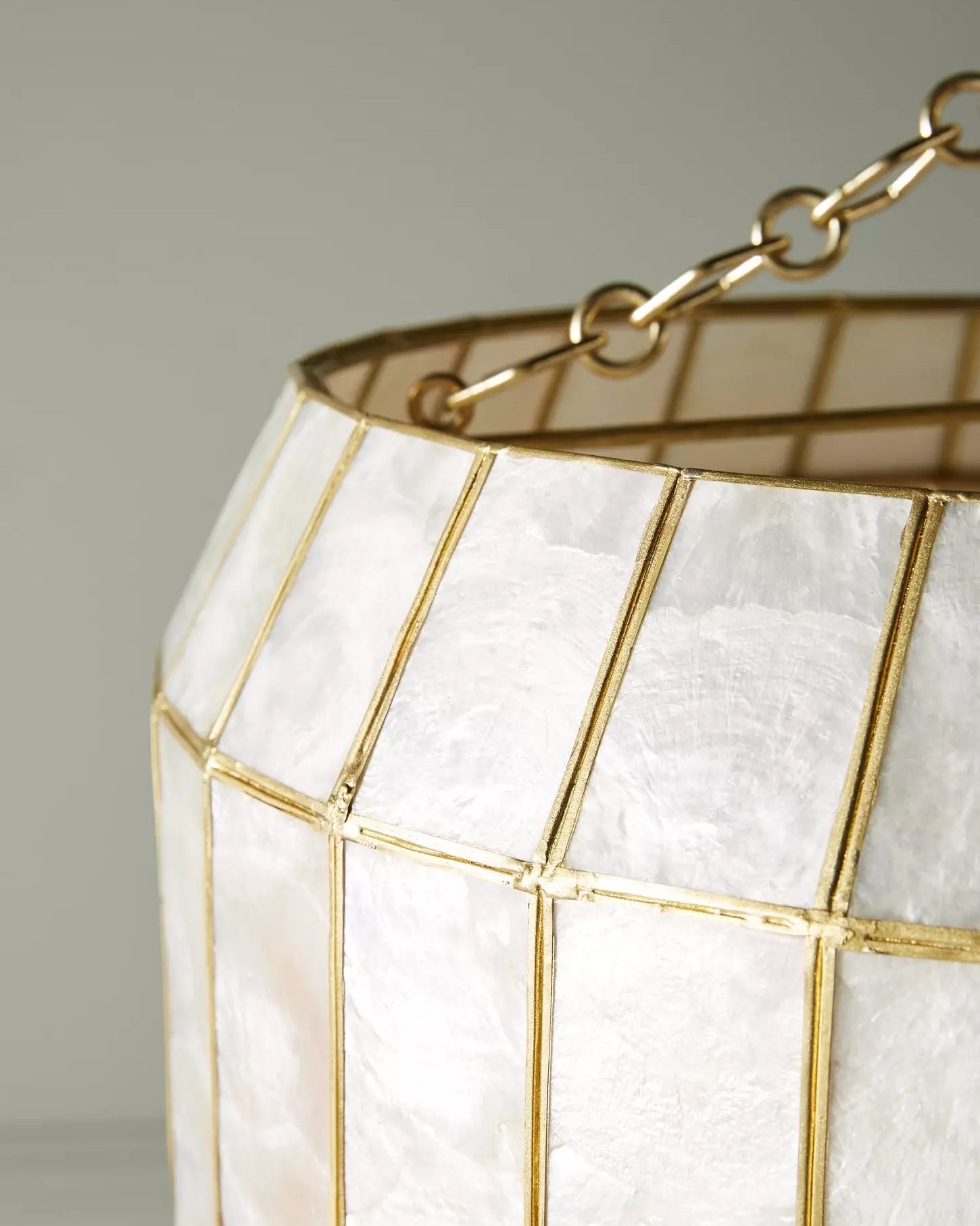 The Aurelia Capiz Pendant Lamp in a minimalist living space.