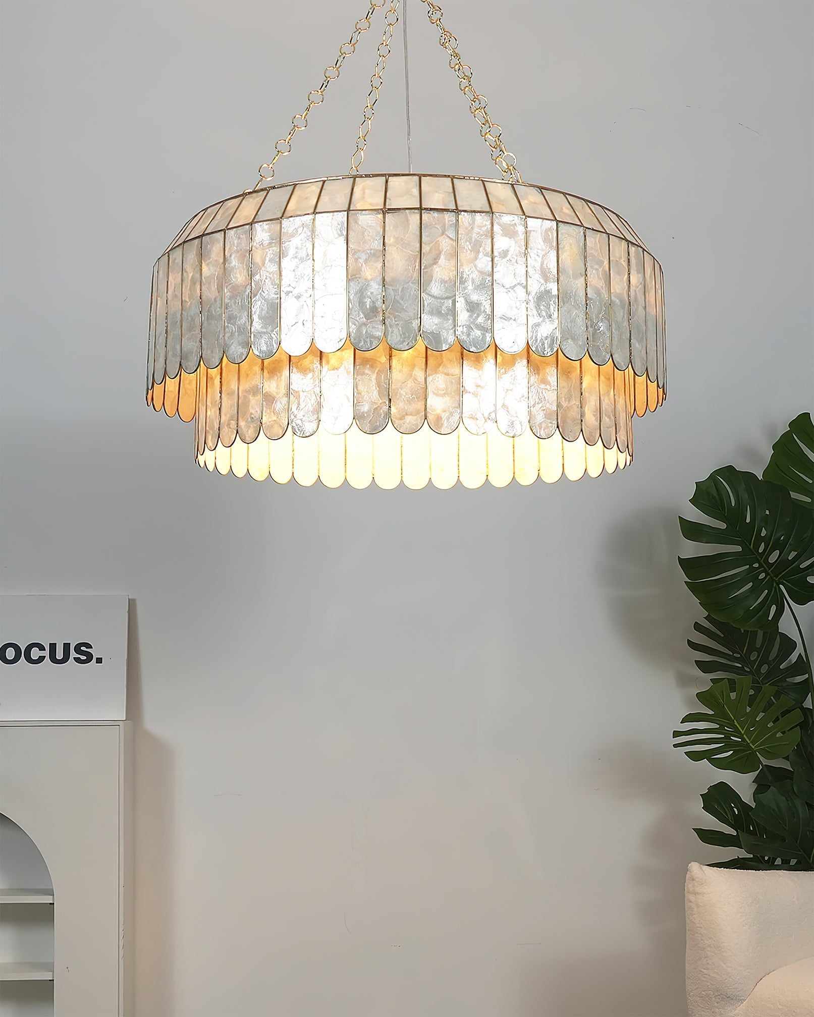 Medium size (23.6 inch) Aurelia Capiz Pendant Lamp on a white background.