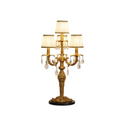 Aurelia Table Lamp with brass body and white fabric shades.