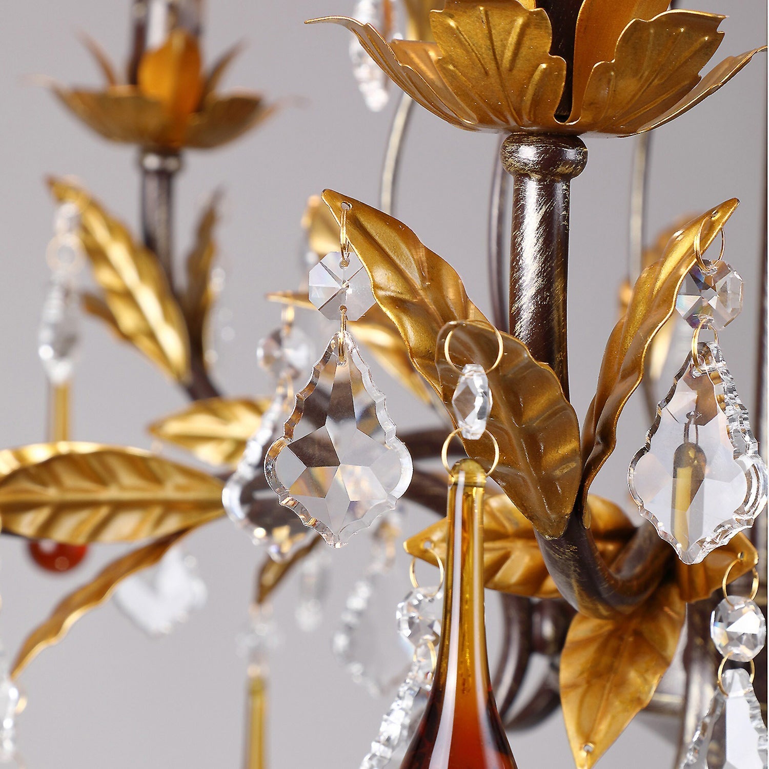 Side profile of the 6-head chandelier against a neutral wall.