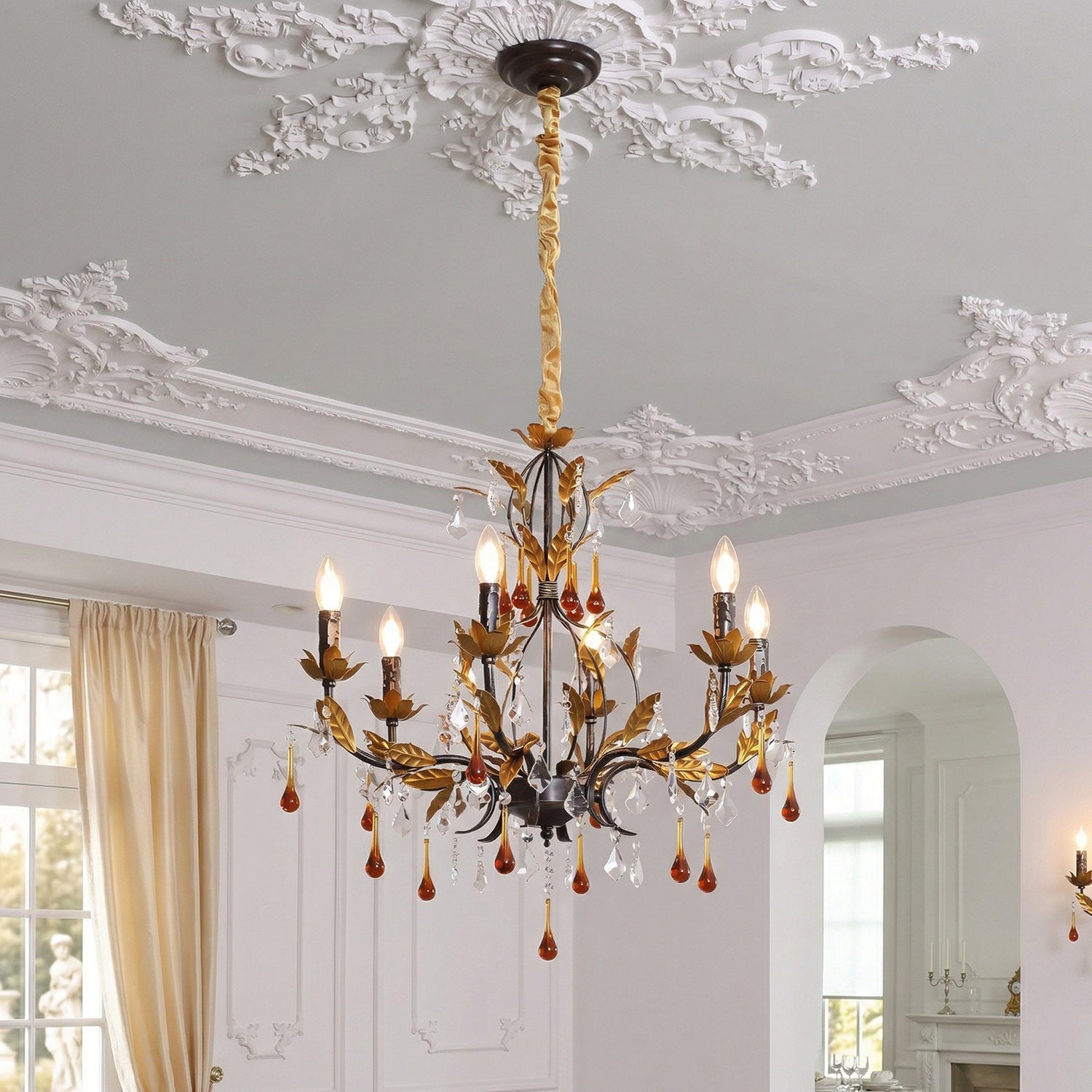 Close-up of the handcrafted metal branches and golden leaves on the Aureline Chandelier.