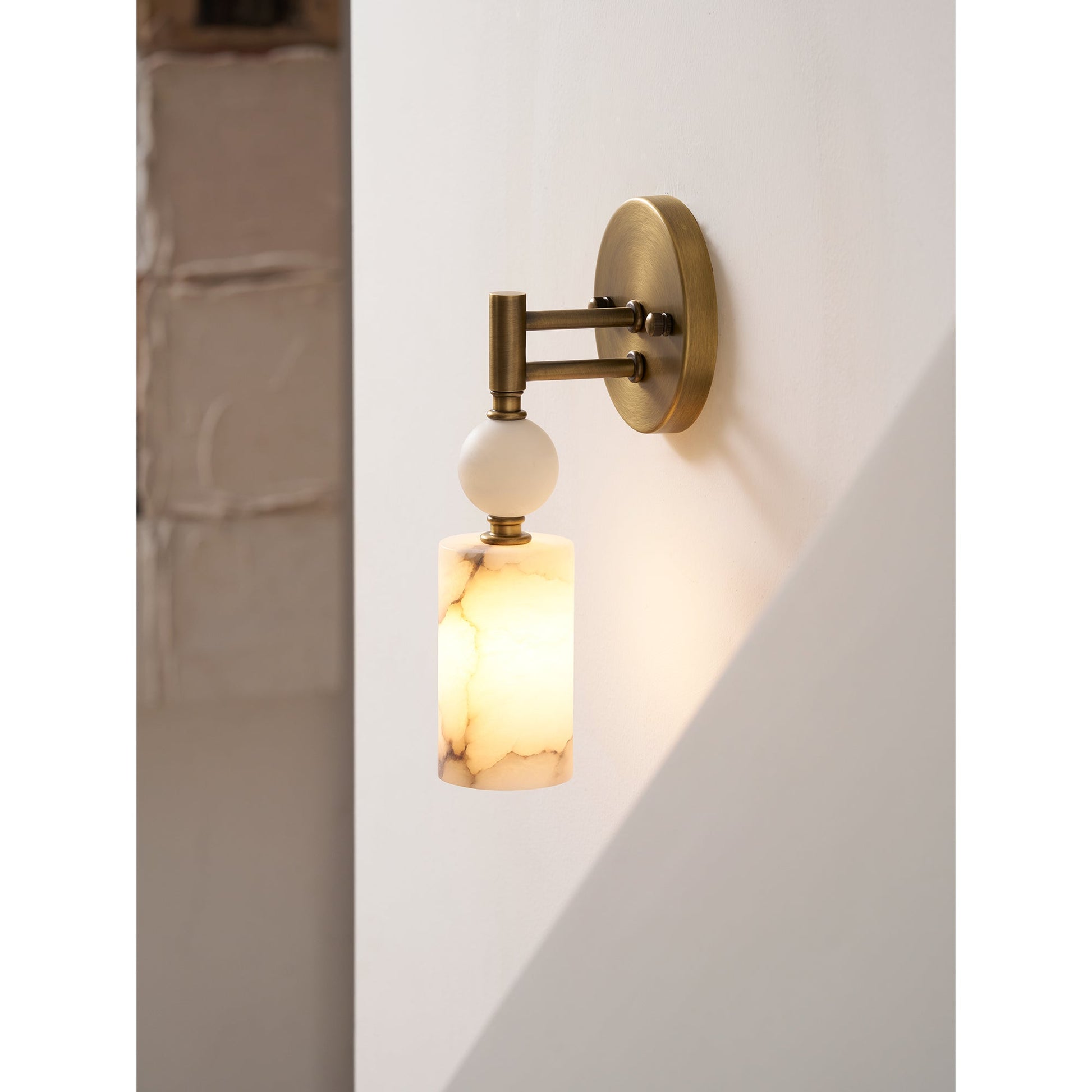 The Kingston Marble Wall Lamp installed in a sophisticated hallway setting.