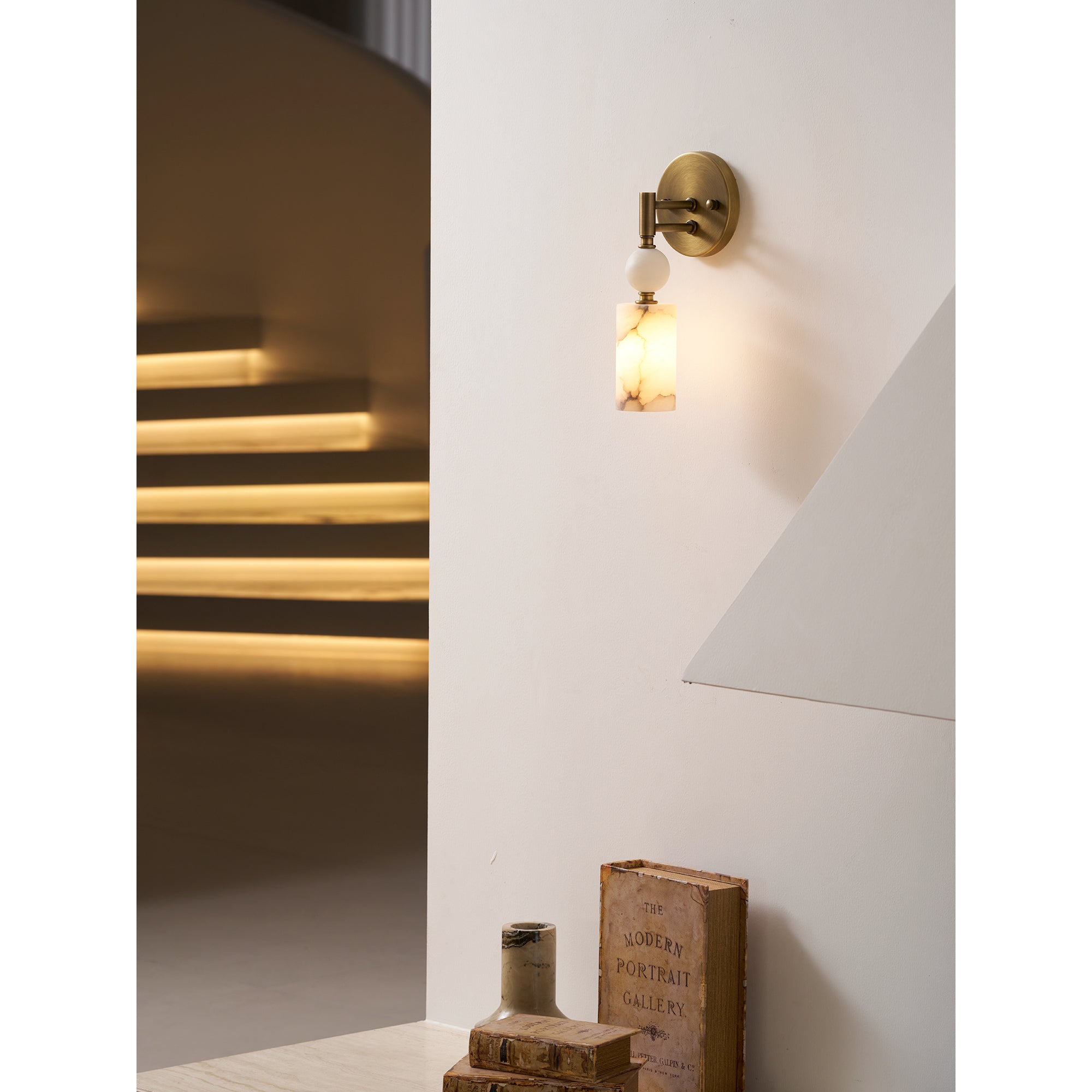 A pair of Kingston Marble Wall Lamps installed on either side of a mirror.