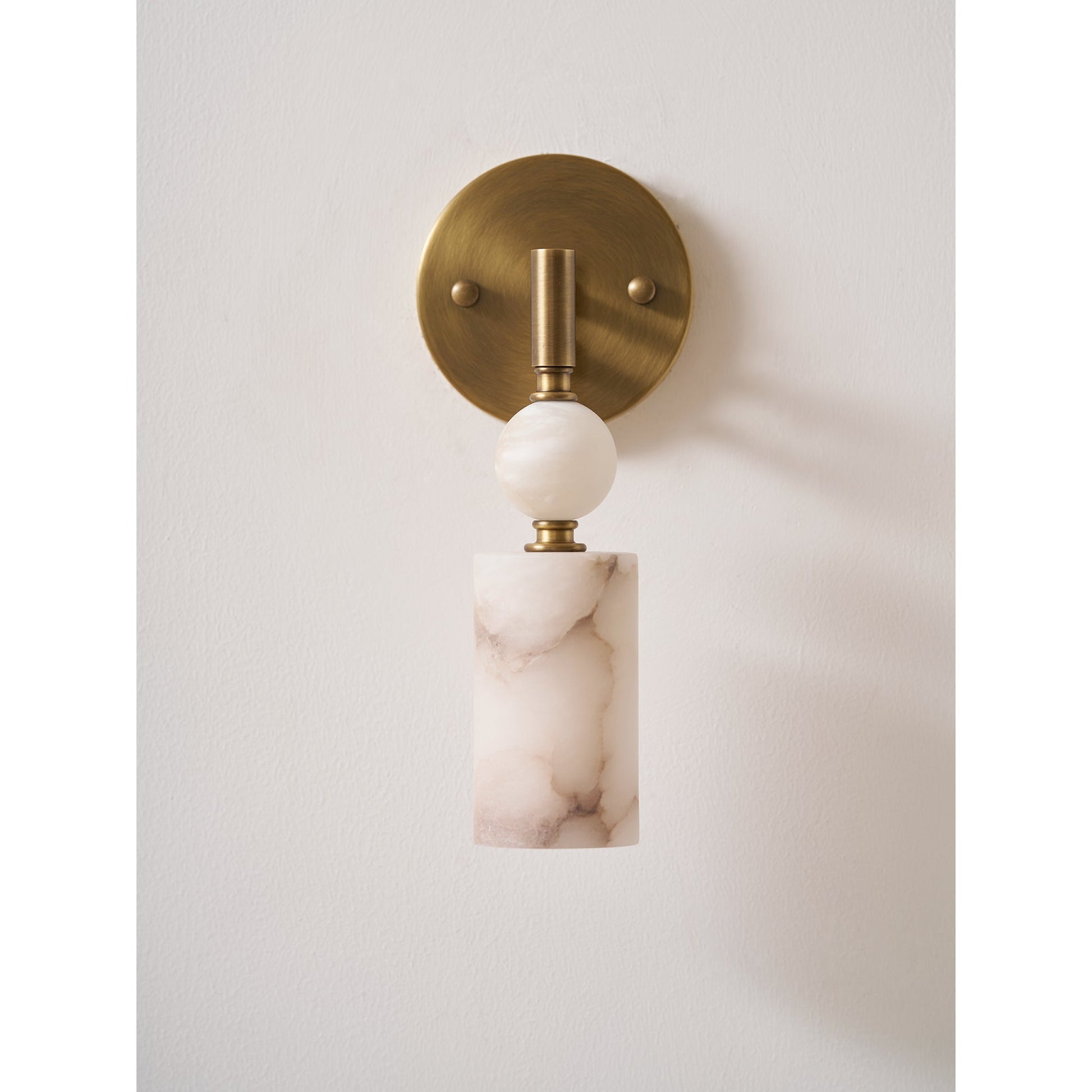 The lamp shown in a bedroom context, providing ambient light.